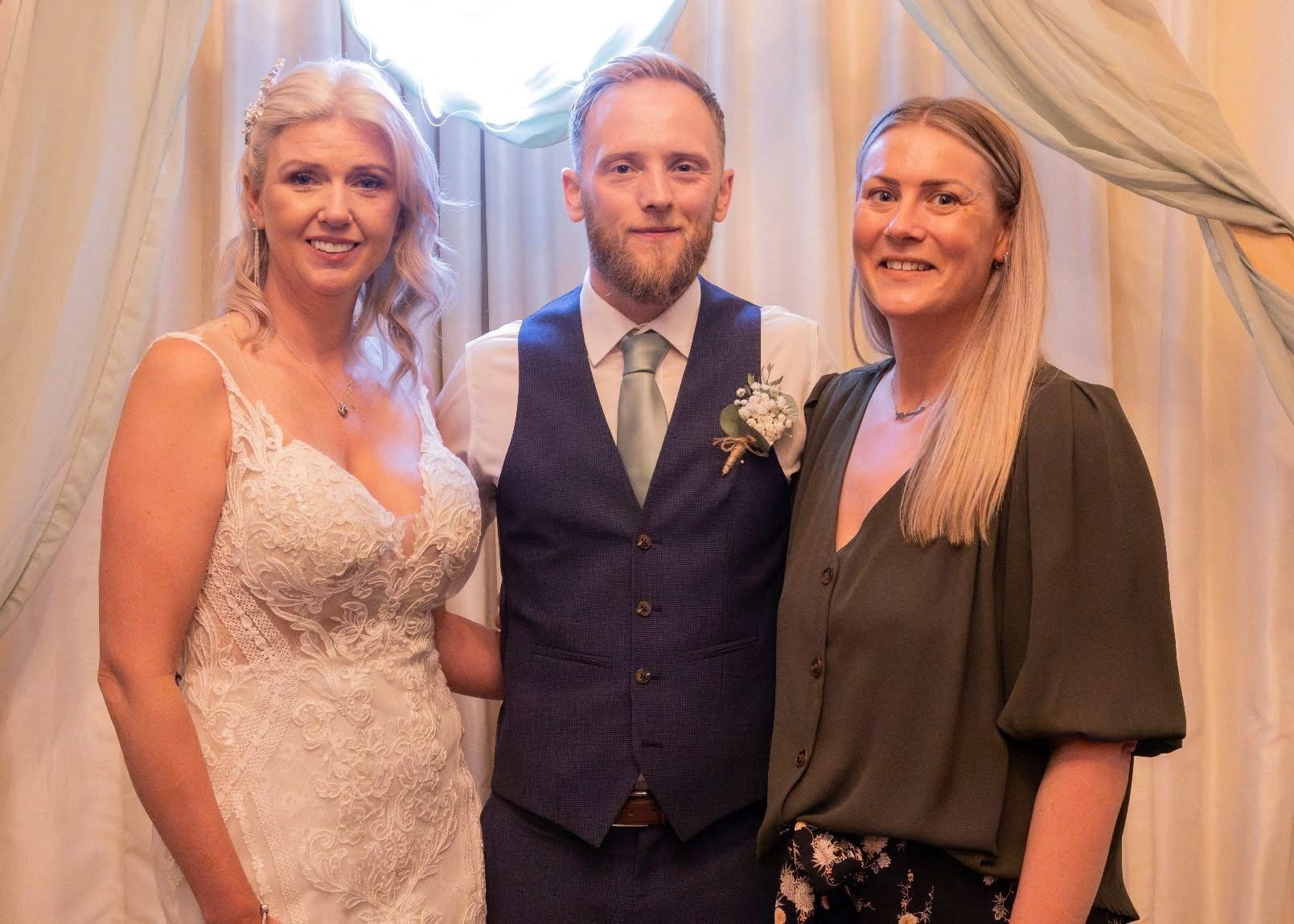 bride and groom at a vow renewal with their celebrant at a Yorkshire venue