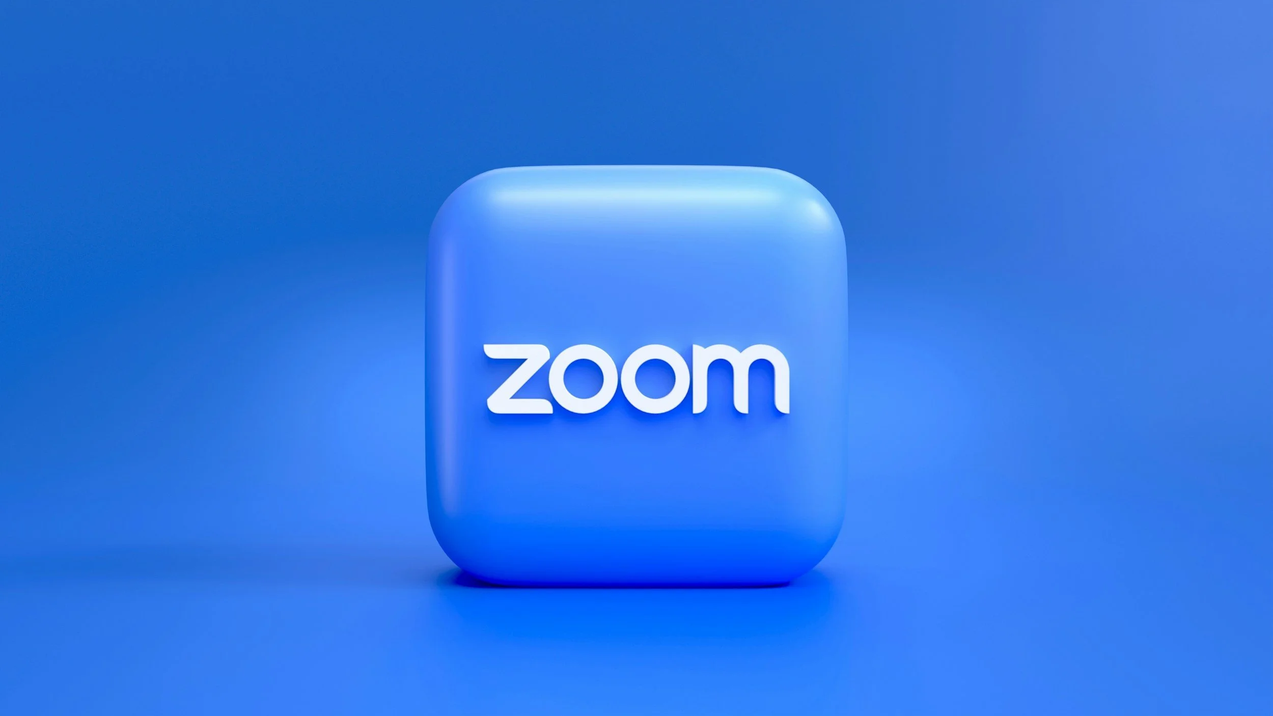 Zoom app icon in blue with white text on a matching blue background.