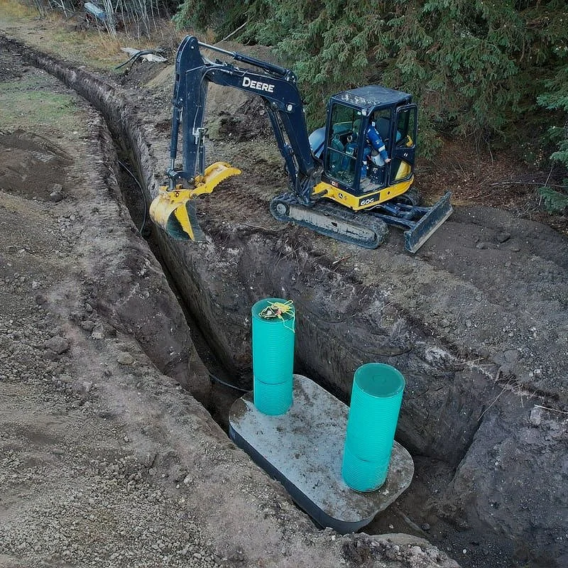 Tank shown: Alberta Wilbert Sales® (AWS®) precast concrete tank — installed by Rooted Earthwork & Wastewater.