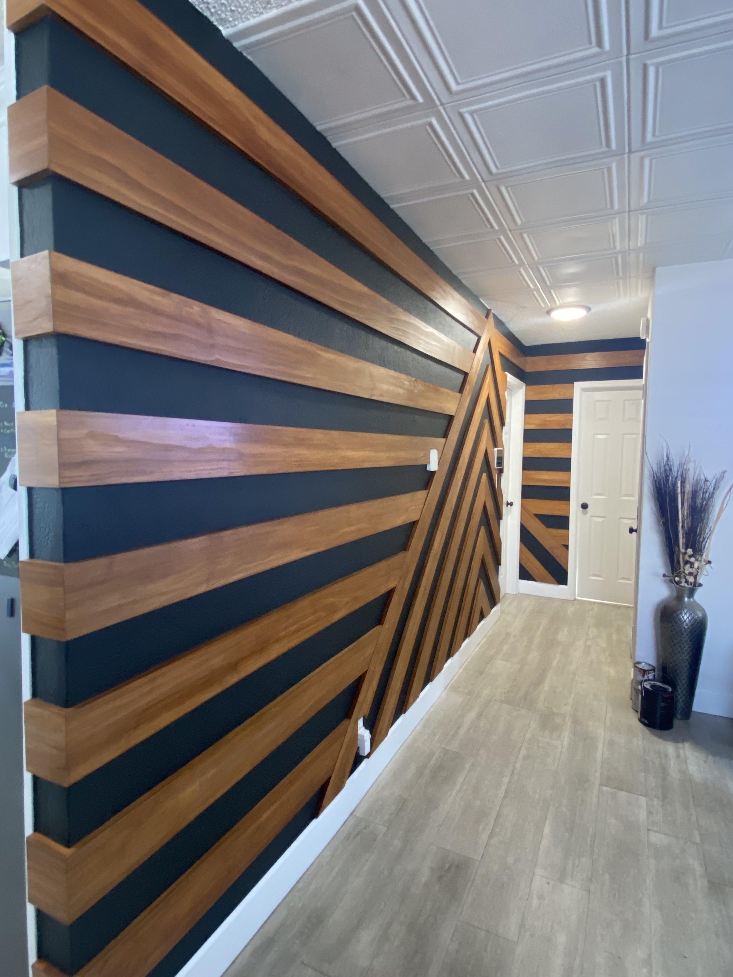 Geometric Stained Board on black wall