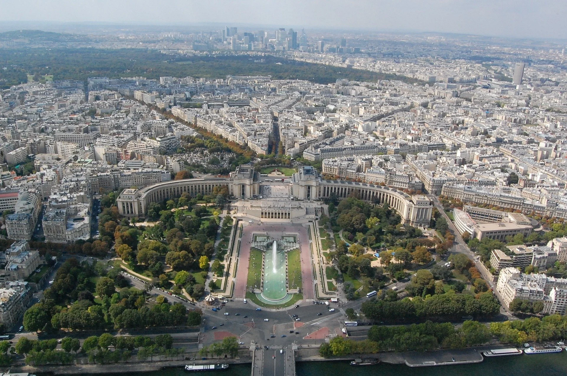 Aerial view of the Trocadéro Gardens and Palace in Paris, France, with the city skyline in the background.