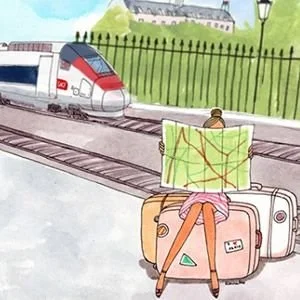 A person sitting on a suitcase at a train station, holding a green map, with a train approaching in the background and a grassy area with trees and a building.