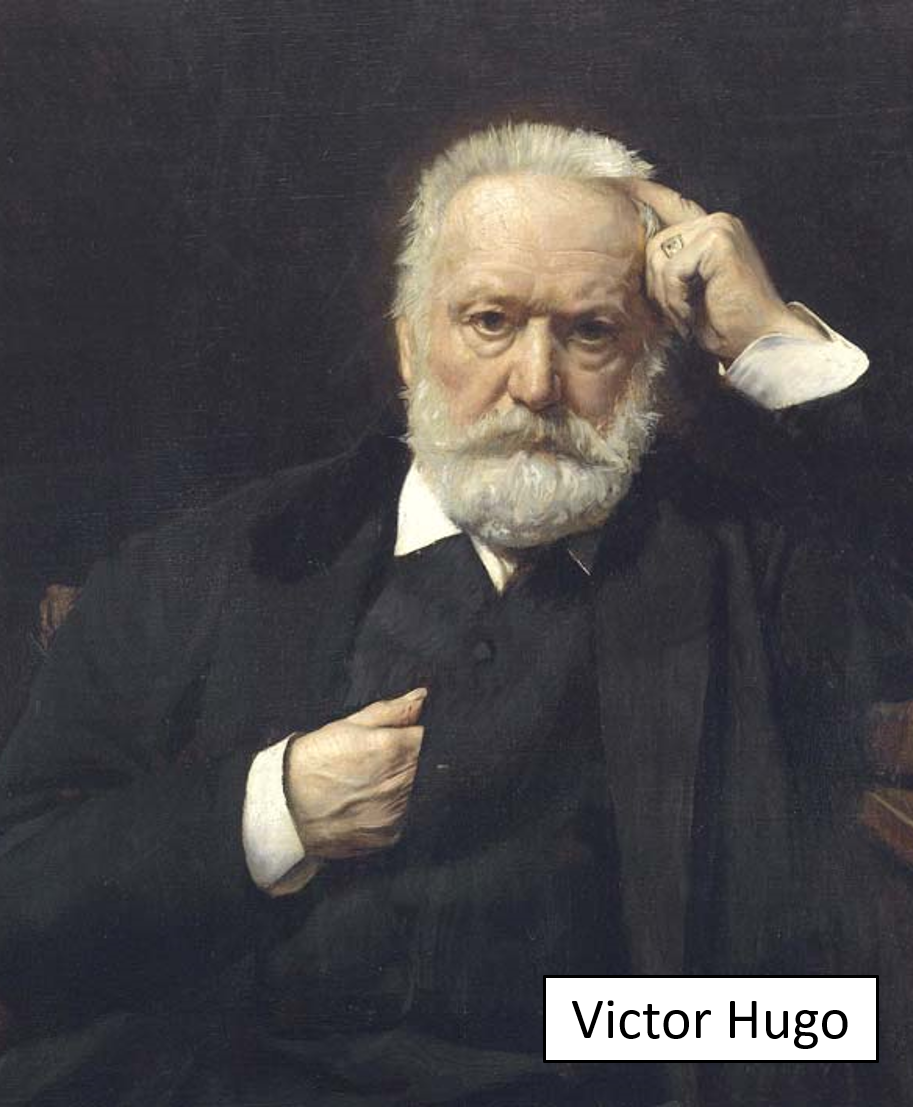 Portrait of Victor Hugo, an elderly man with white hair and a beard, wearing a dark suit and white shirt, against a dark background.