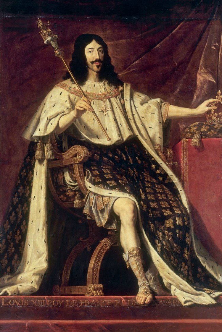 Portrait of a man dressed in regal robes, sitting on a throne, holding a scepter, with a crown on a table nearby, and a red drape behind him.