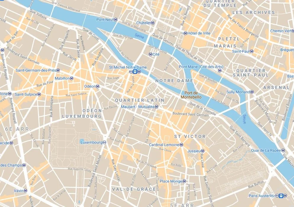 Map of central Paris showing neighborhoods, streets, and the Seine River with metro stations marked.