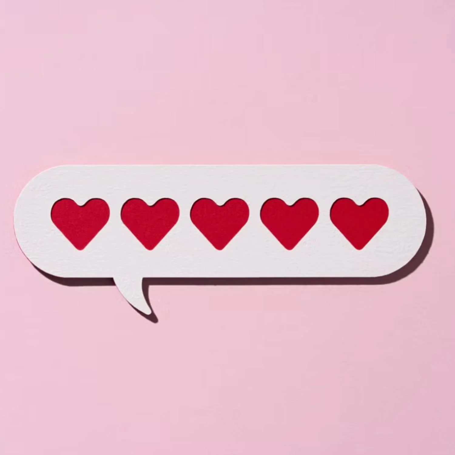 Red Hearts in a Chat Bubble on Pink Background.jpg
