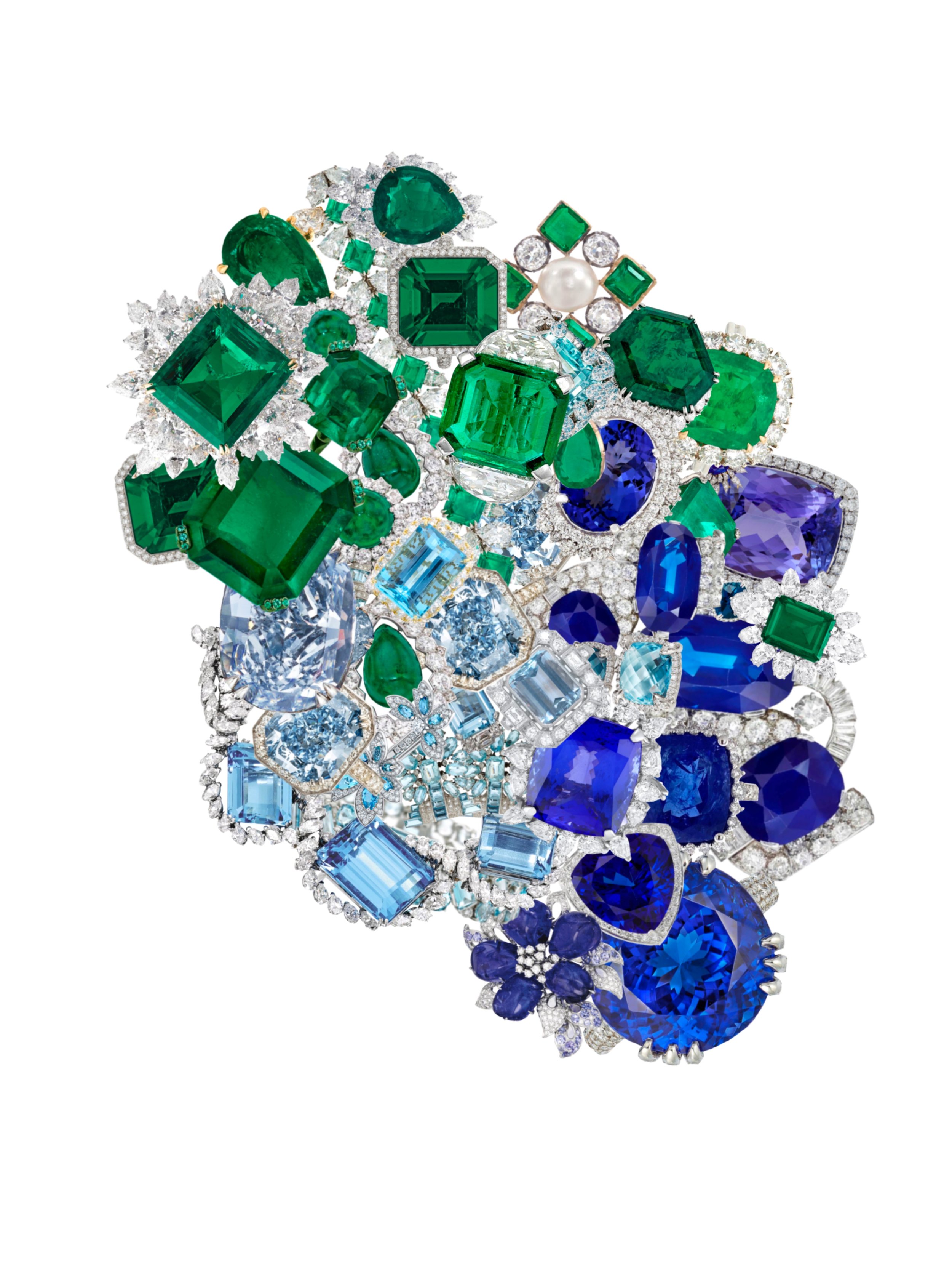 Custom large scale birthstone art piece by Jessica Taylor of Hold That Punch. Assorted gemstones and birthstones in various colors and cuts. Collection of cut emeralds, sapphires, and diamonds in various shapes and sizes arranged decoratively.