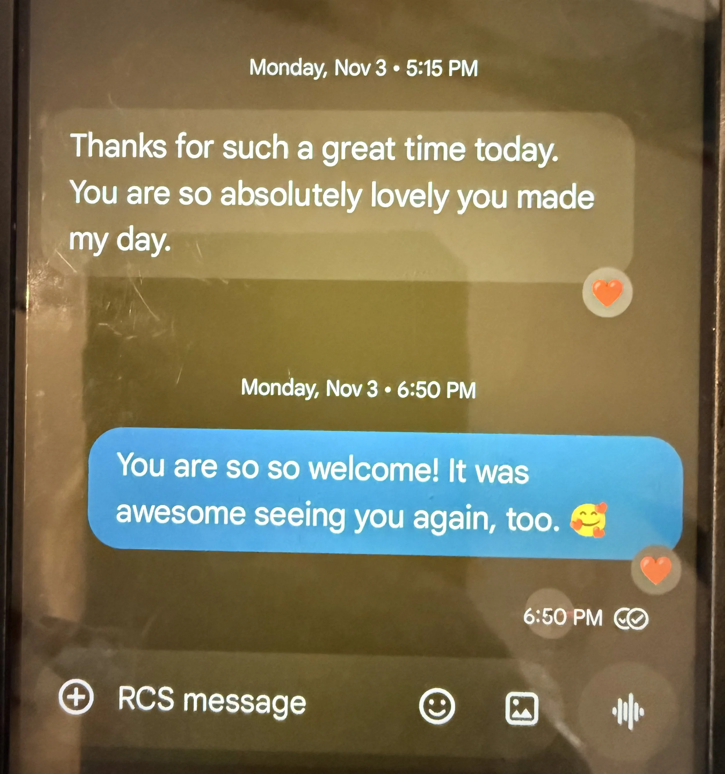 A digital screen displays a series of text messages and timestamps, showing a conversation about a pleasant encounter on November 3rd. The messages include expressions of gratitude and friendly remarks, with heart emojis and a sticker of a smiling ca