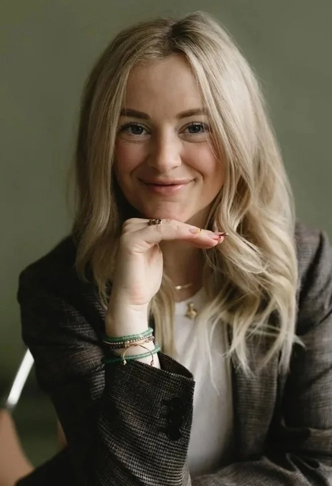 Emily Jean Campbell sitting and smiling at the camera