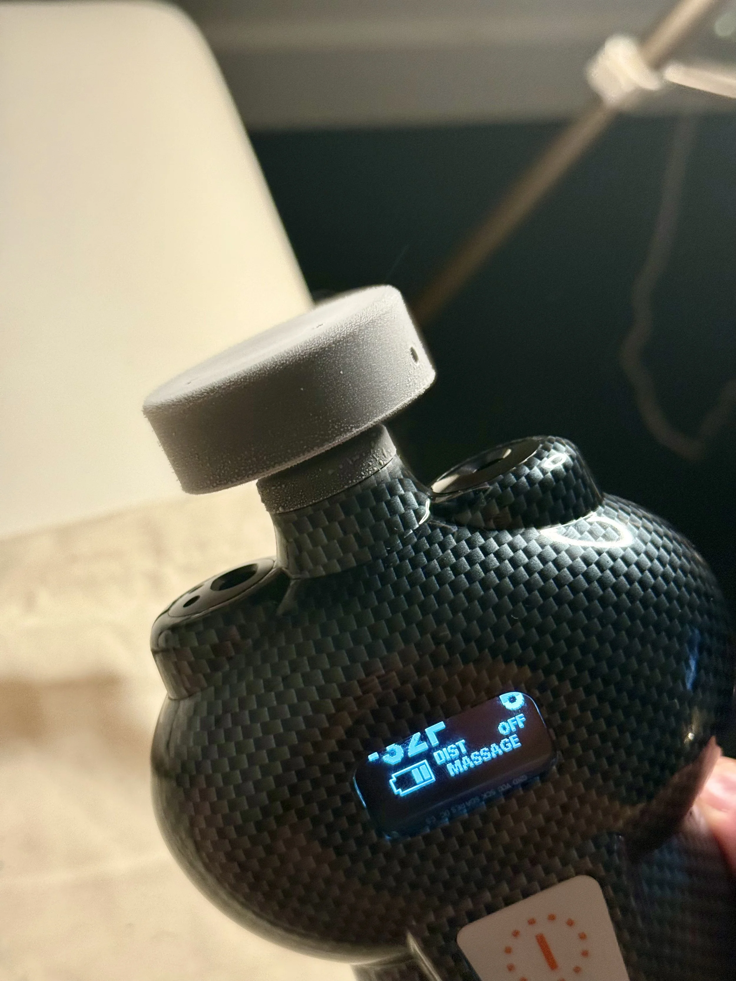 Close-up of the massage tool attachment on the SubZero cryotherapy device from America Cryo showing the frost on the tip from the CO2 vapor.