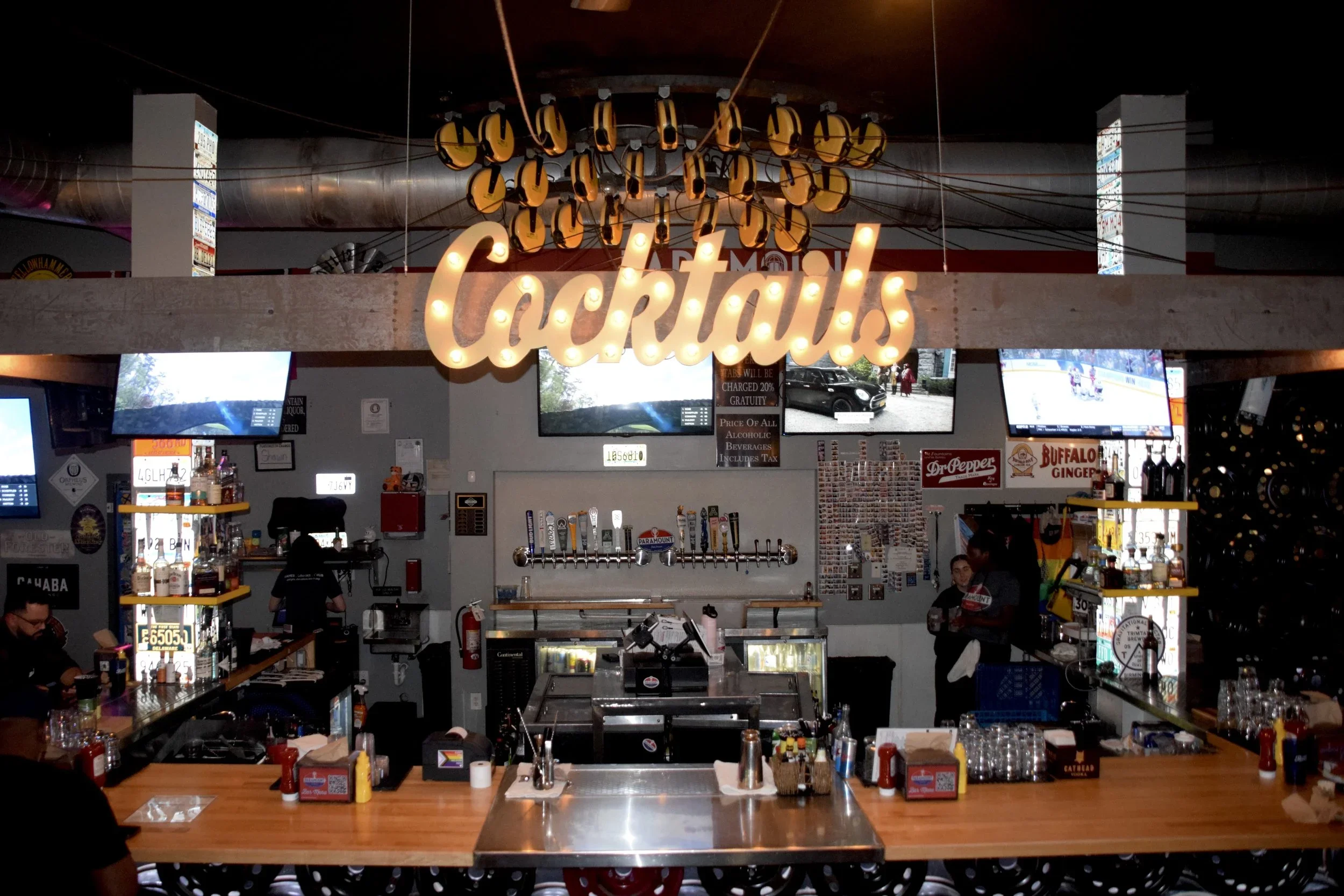 Inside Paramount barcade in Birmingham Alabama with classic arcade games and pinball machines