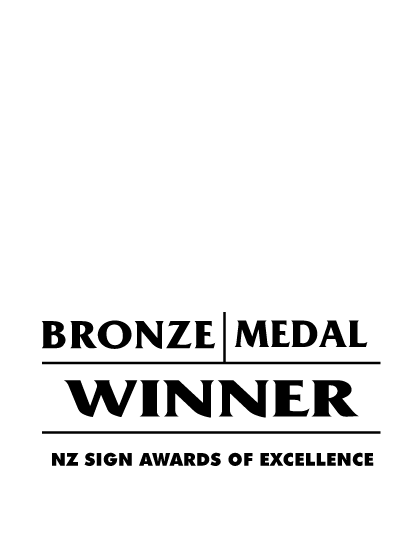 Bronze medal winner logo with a stylized ribbon and text indicating 2025 NZ Sign Awards of Excellence.