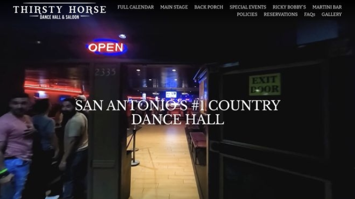 Website homepage to Thirsty Horse dance hall and saloon in San Antonio, Texas, with a neon 'Open' sign, people standing near the entrance, and visible hallway inside