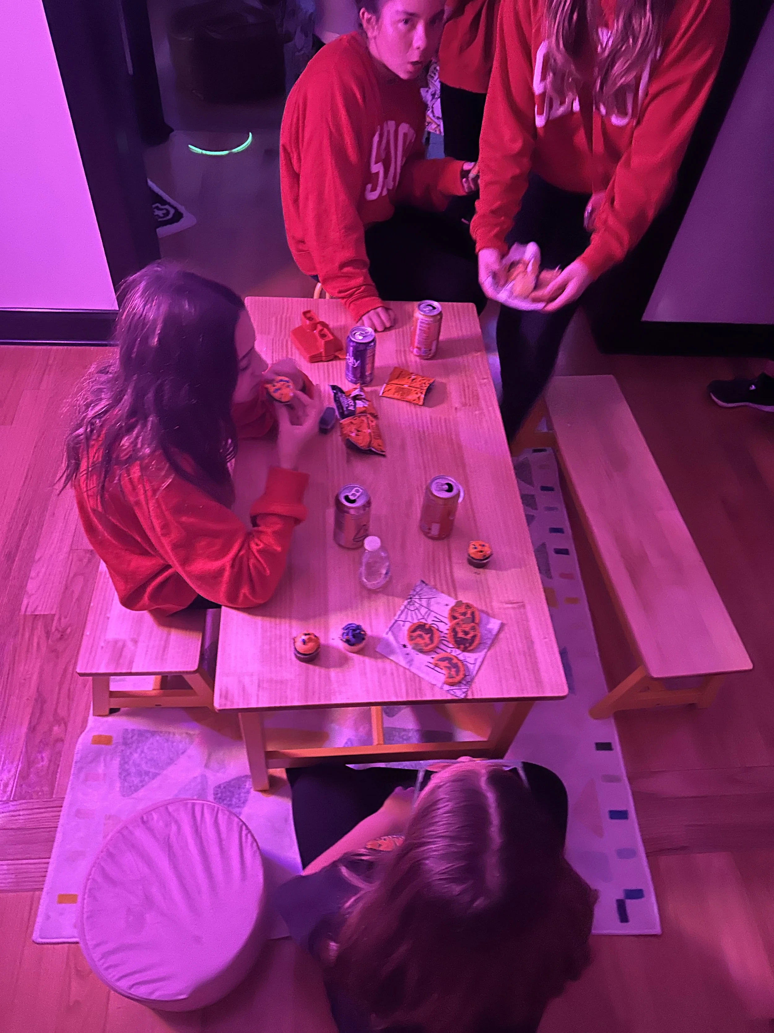 Tweens playing a lively Halloween-themed bingo game at The Clubhouse Wellness Center in Chester County — social connection and laughter through friendly competition.