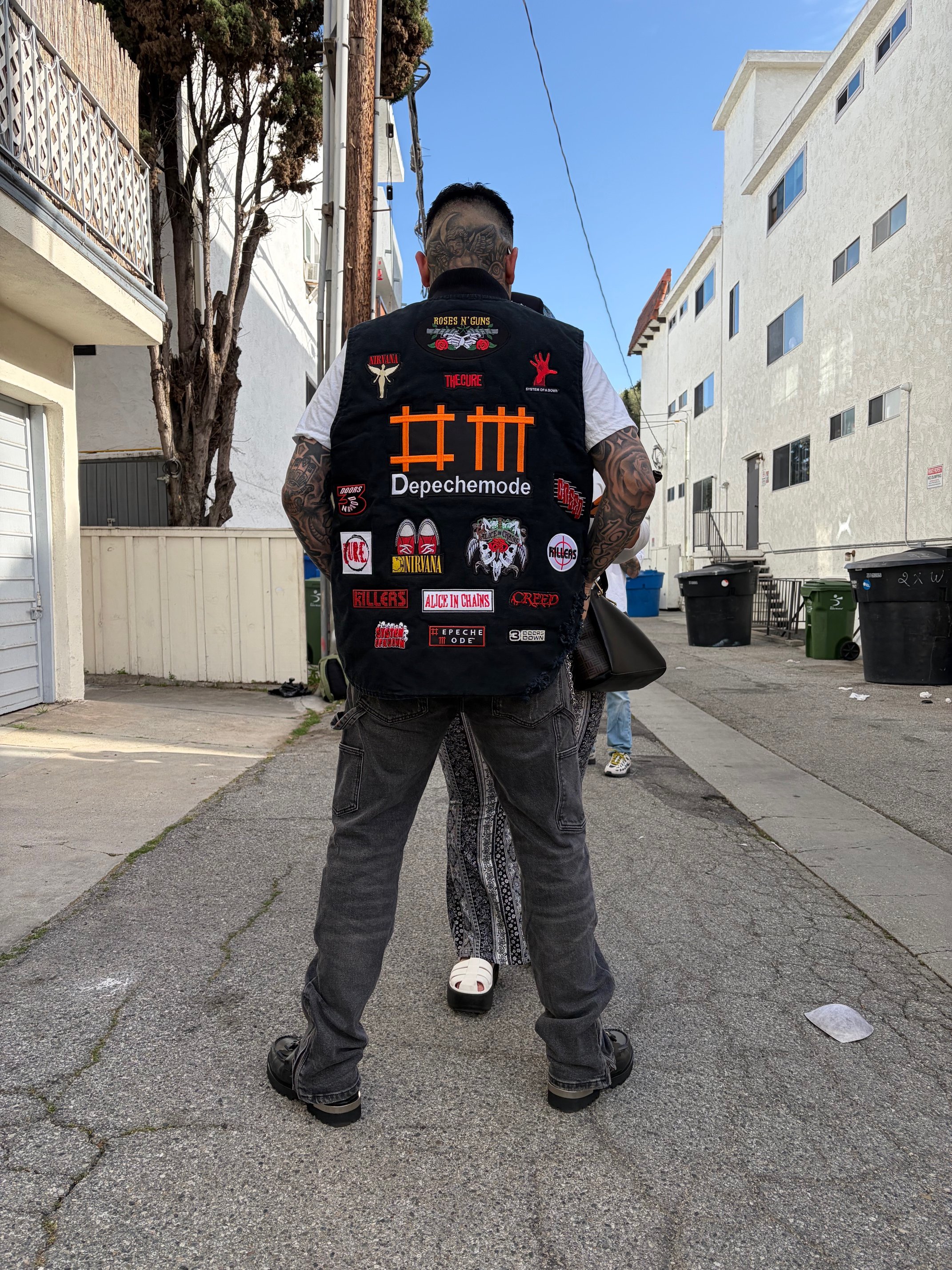 OG Streetwear GOD modeling a custom rock-n-roll themed vest. 