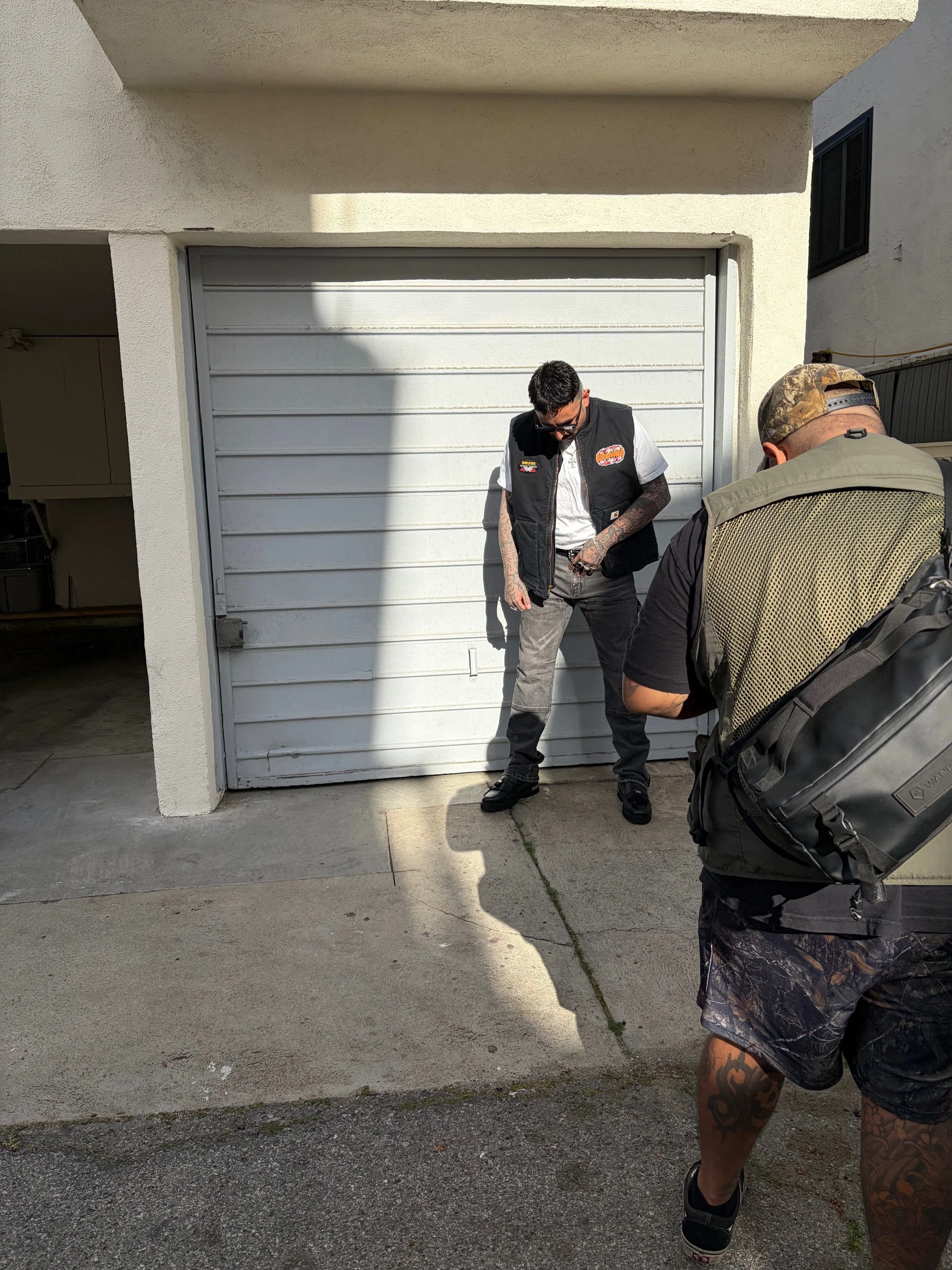 OG Streetwear GOD modeling a custom rock-n-roll themed vest. 