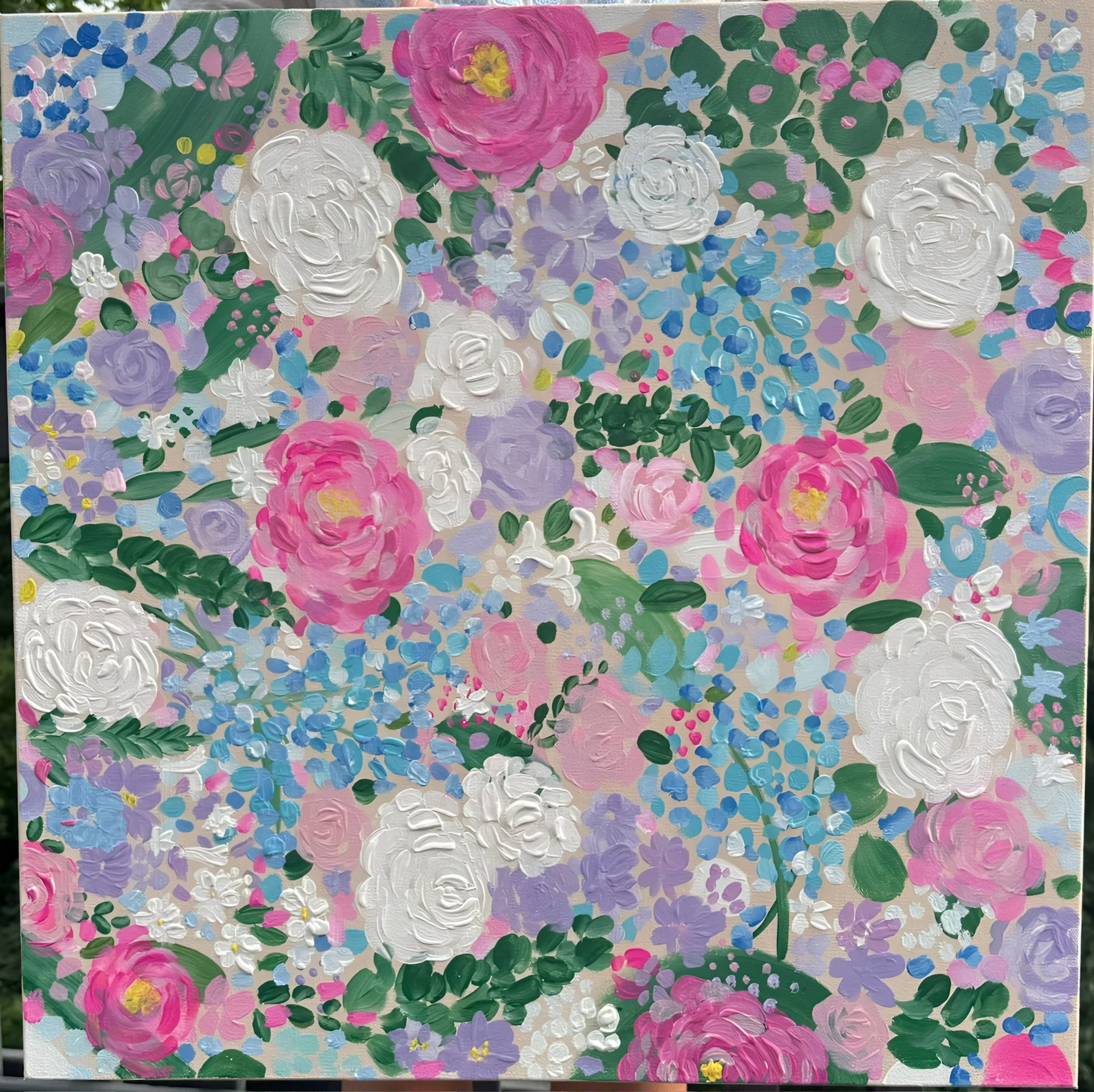 A colorful abstract painting featuring pink, purple, white, and blue flowers with green leaves, created with thick, textured brushstrokes.