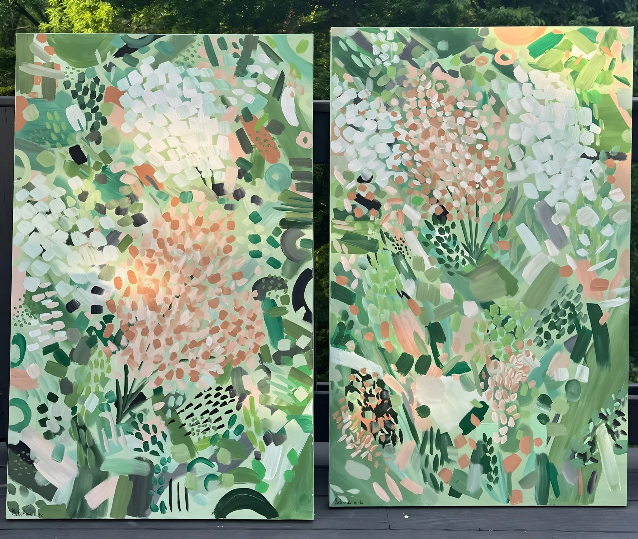 Two large abstract floral paintings with green, white, pink, and black brushstrokes, depicting impressionistic representations of flowers and foliage.