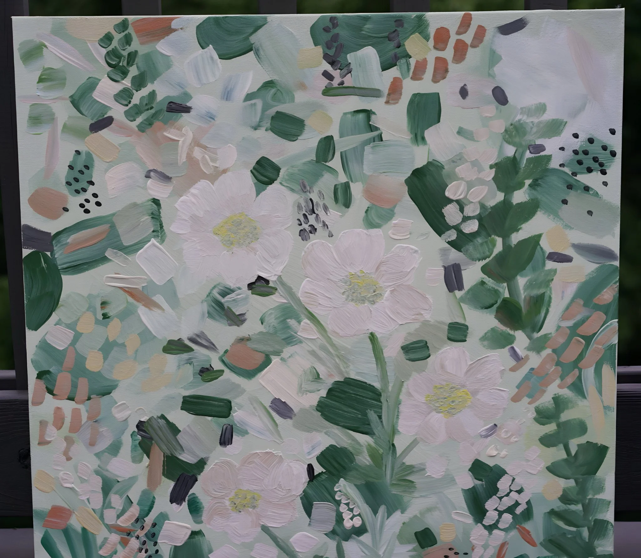 Abstract floral painting with white, pink, and green brushstrokes, and black dotted accents.