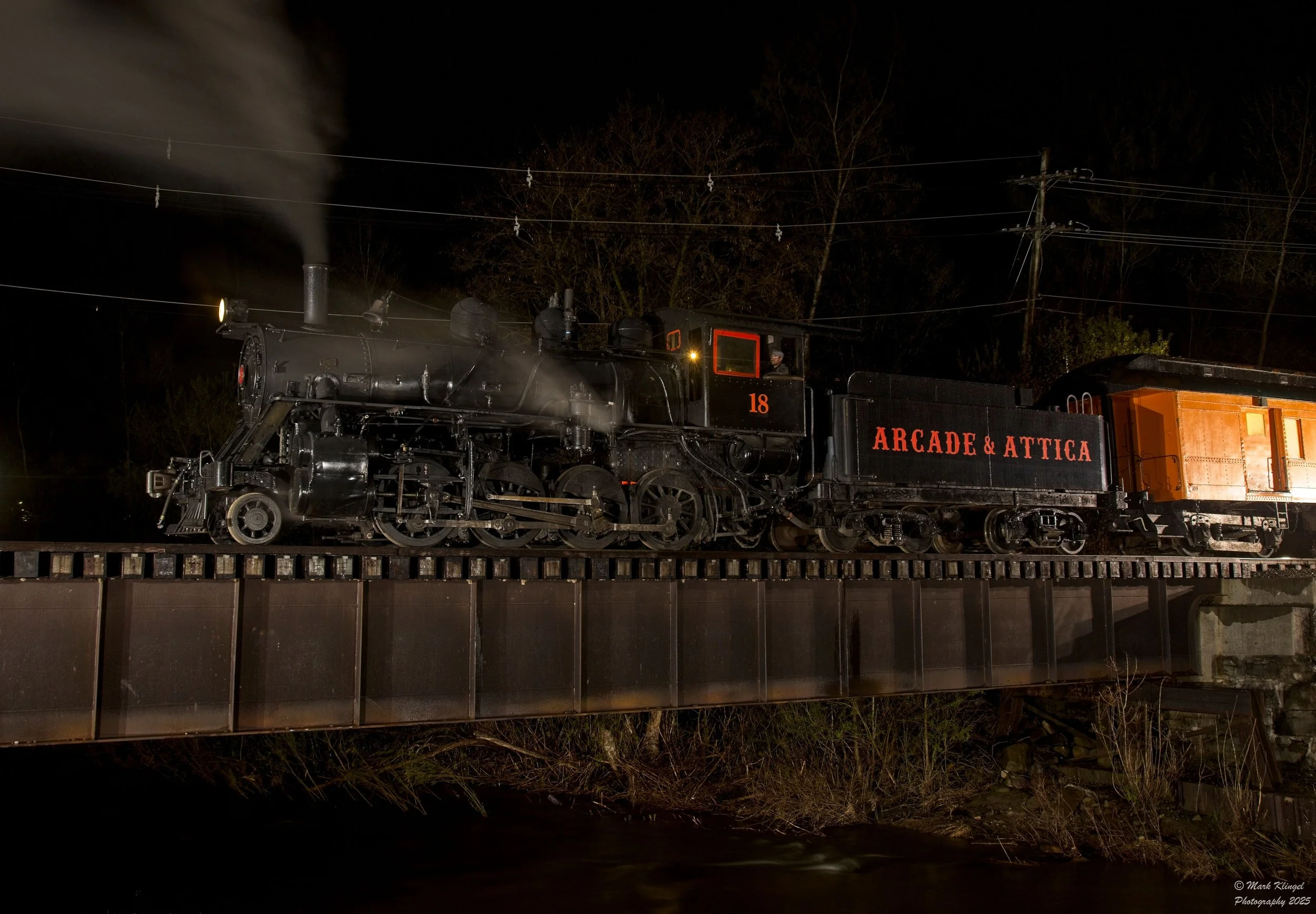 Arcade & Attica No. 18 rests at night on the Cattaraugus Creek bridge during a Dynamo Productions photo charter. Mark Klingel photo.