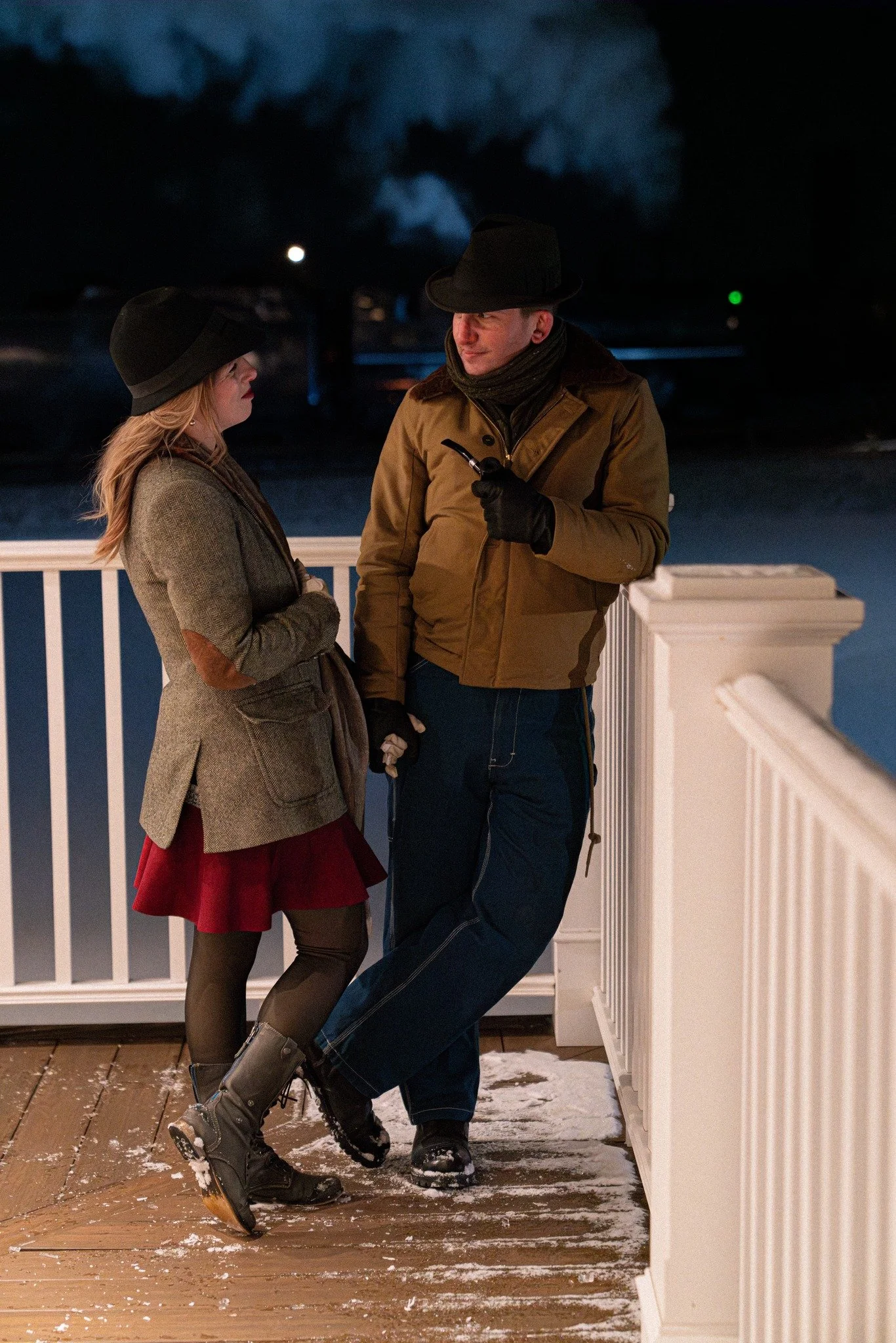 Starr Meloche and Kelly Lynch pose on a porch as Norfolk & Western No. 429 thunders by in the background during a Dynamo Productions photo charter. Jonah Collins photo.