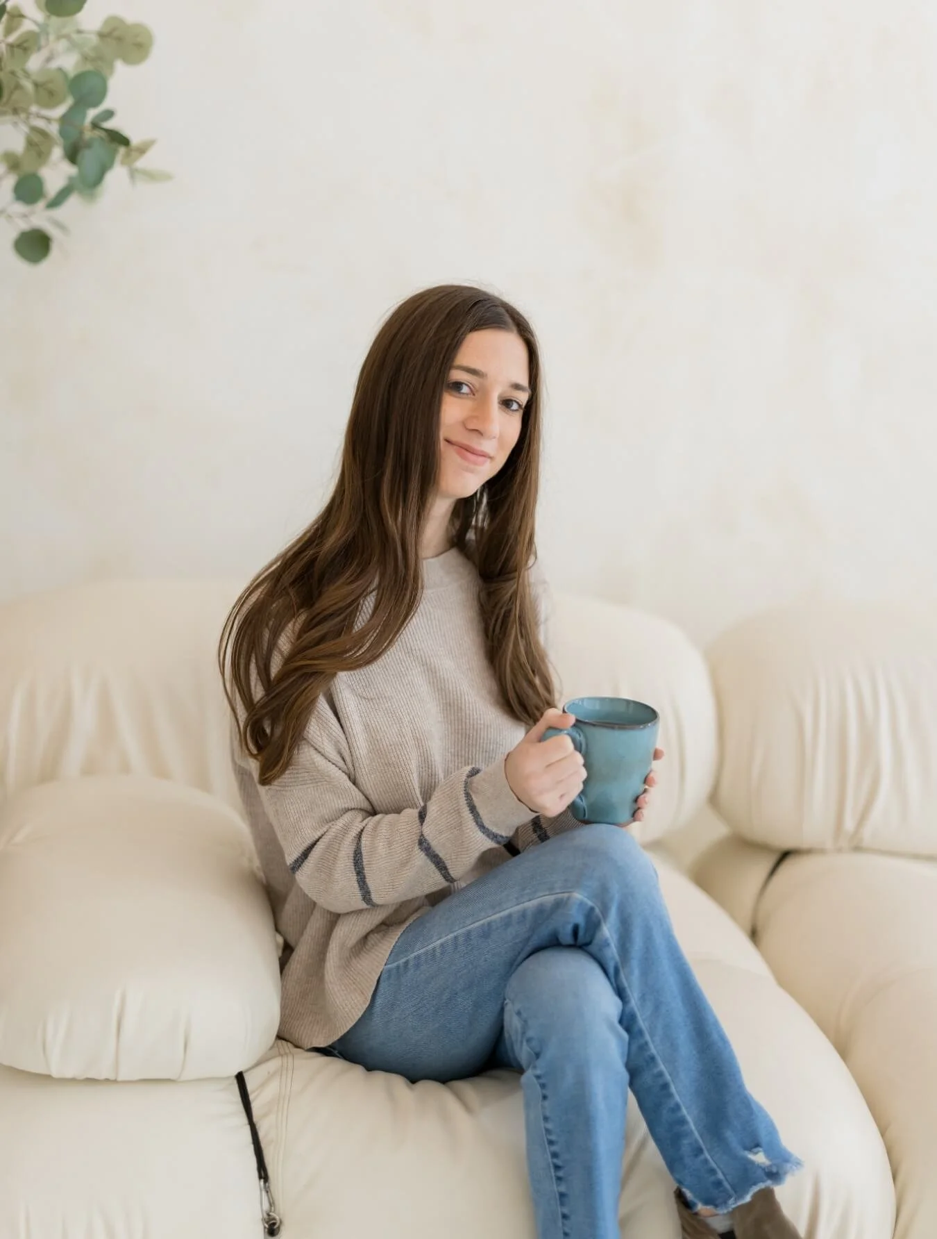 photo of jackie, brand and website design expert, holding a coffee mug