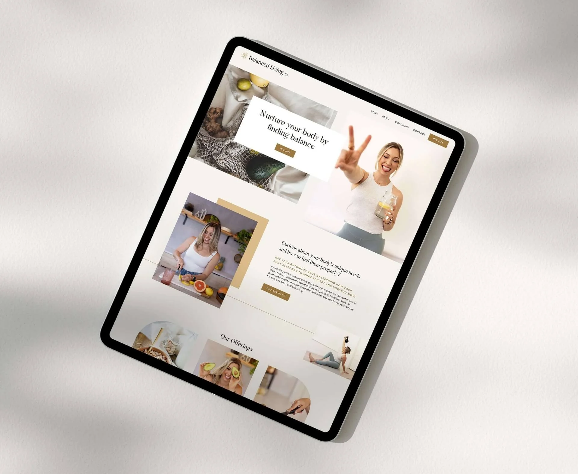 Tablet displaying a website for balanced living with images of women and healthy foods on a neutral background.