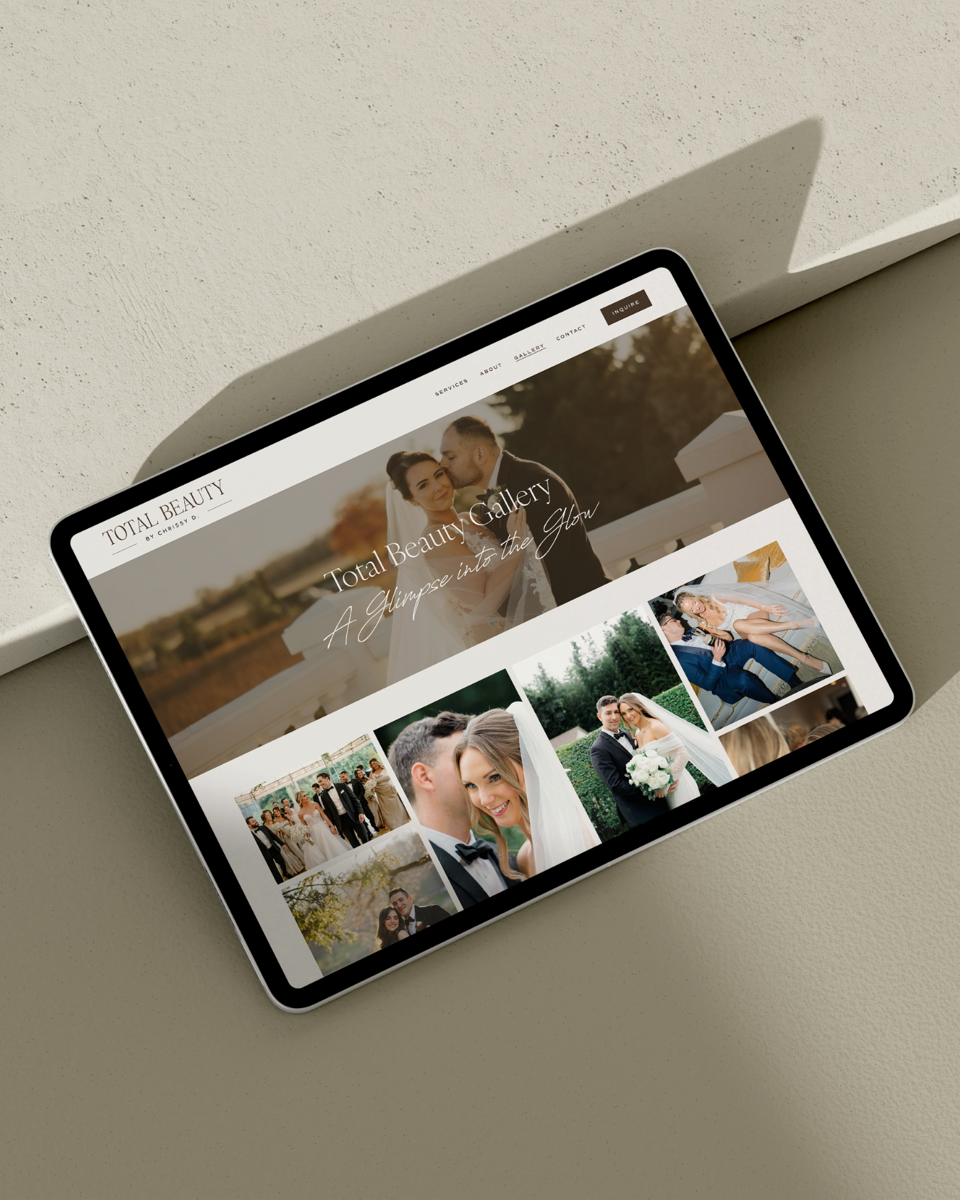 Tablet displaying a photography website titled 'Total Beauty' with wedding photos and the tagline 'A glimpse into the flow'.