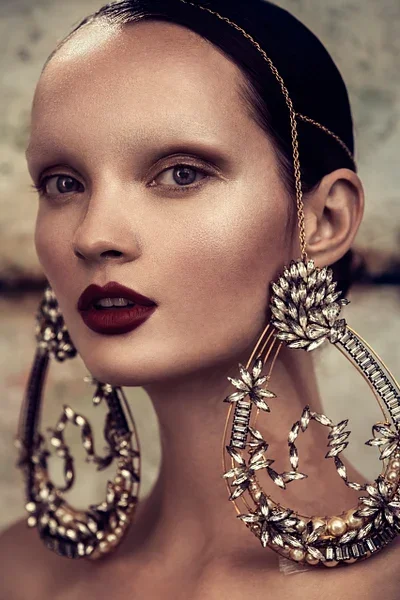 stunning-portrait-model-elaborate-statement-earrings.webp
