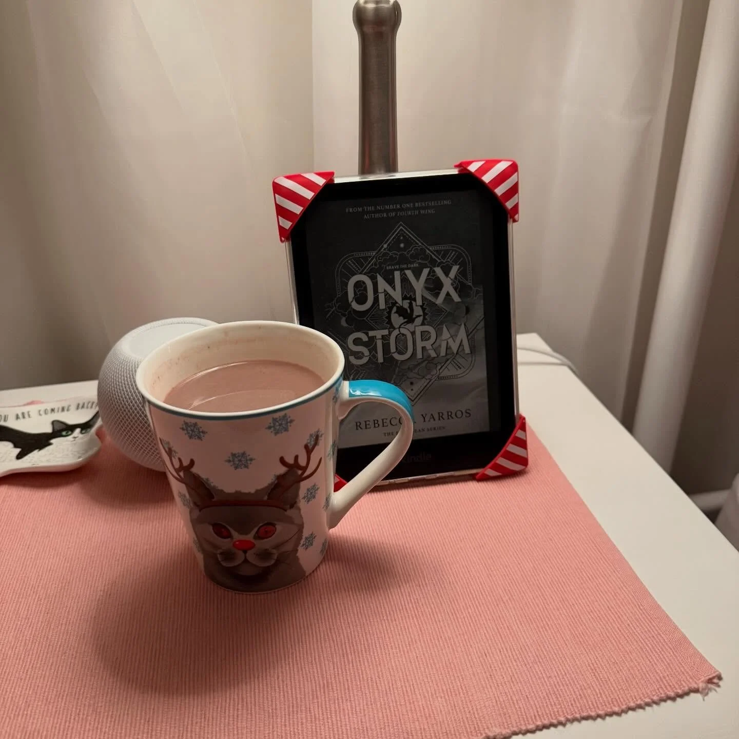 This is what I call Christmas Eve! My version of jolabokaflod with @lofigirl on the tv, some comfy @the_oodie pjs and curling up in bed with book 3 of the Empyrean by @rebeccayarros on my kindle with @strapsicle holiday straps and a hot chocolate.