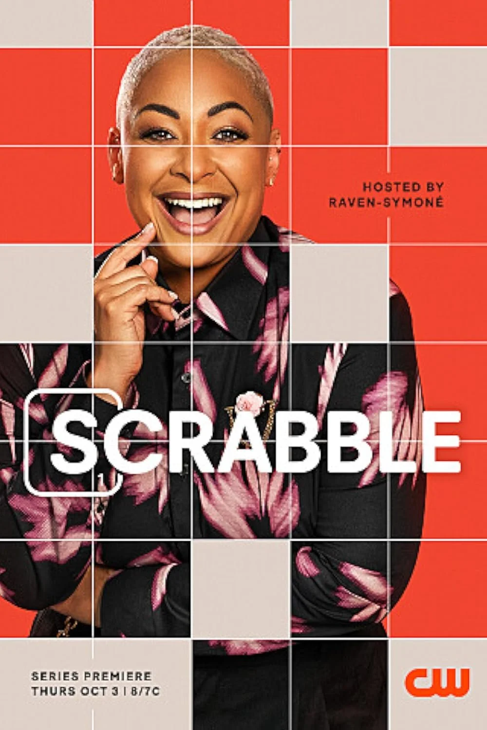 Promotional poster for a TV series premiere of 'Scrabble' on The CW, hosted by a smiling individual. The background is red with a grid pattern.