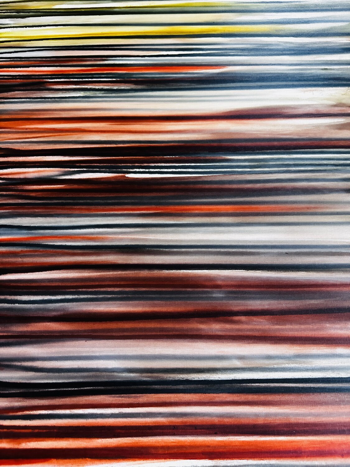 Abstract pattern of horizontal multicolored lines in shades of yellow, red, black, white, and blue.