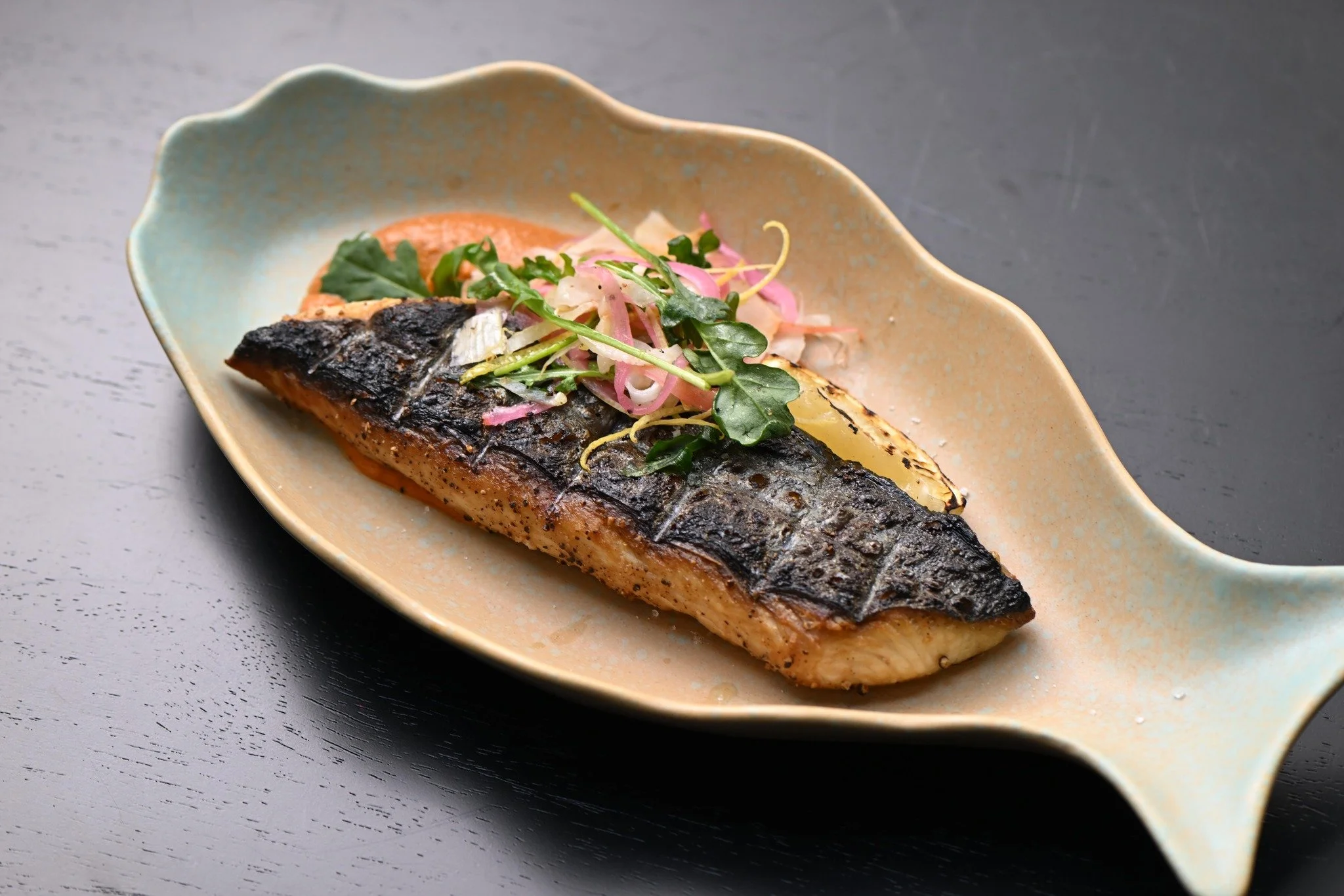 If you&rsquo;re into smoky, bright, and bold flavors, this Josper-grilled mackerel is calling your name 🐟🔥
Kombu-cured Spanish mackerel, nutty romesco, and a crisp pickled fennel salad.

📌 We open daily from 11 AM - Midnight. Book your table via D