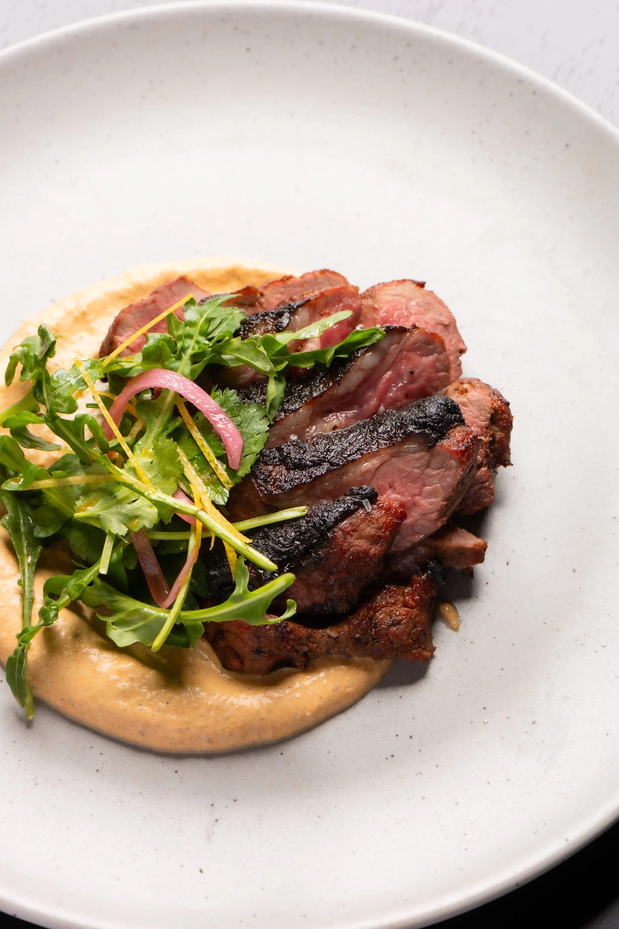 Aus. Lamb Picanha with Chipotle Cream
lamb rump served with rocket salad and house mascarpone cheese spiked with smoked japapeno pepper. Halal food, gluten free.