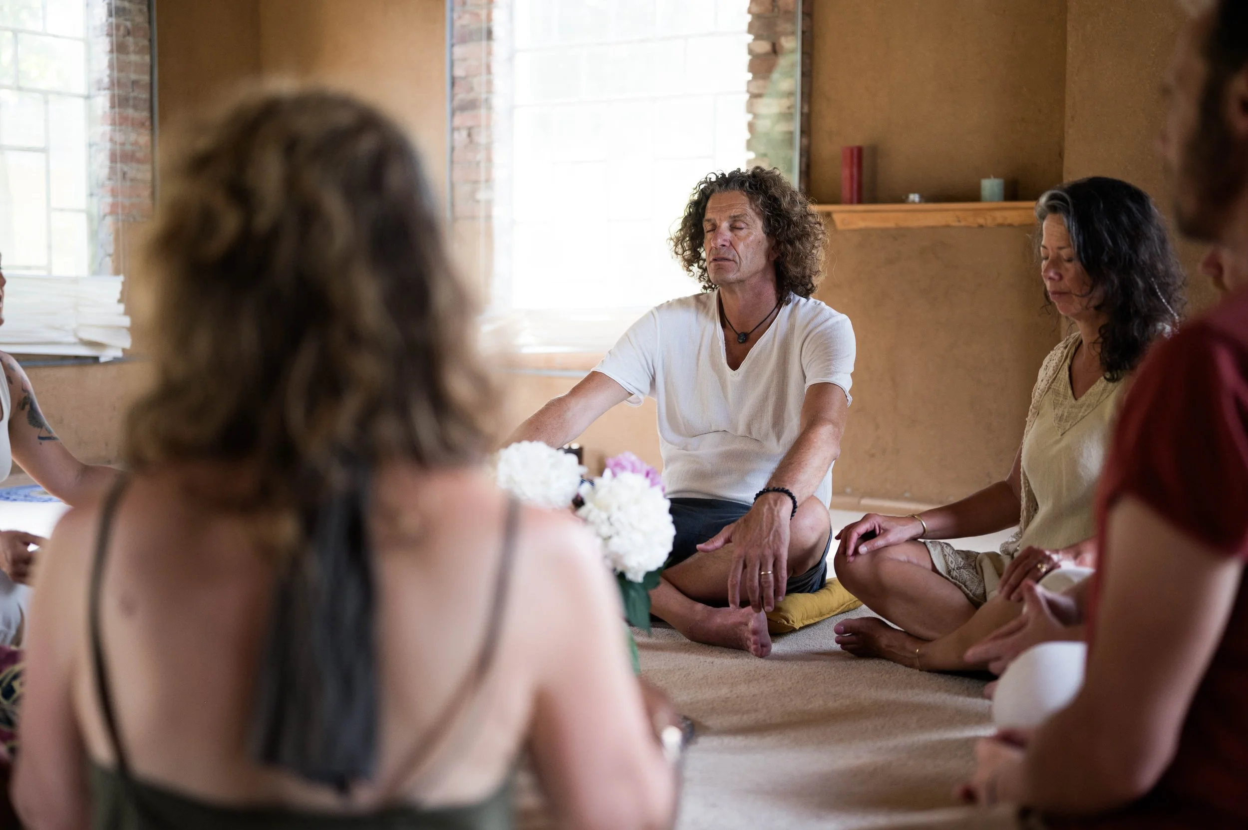 Participants meditating during psilocybin truffle ceremony at The Heart's Door Retreats Netherlands