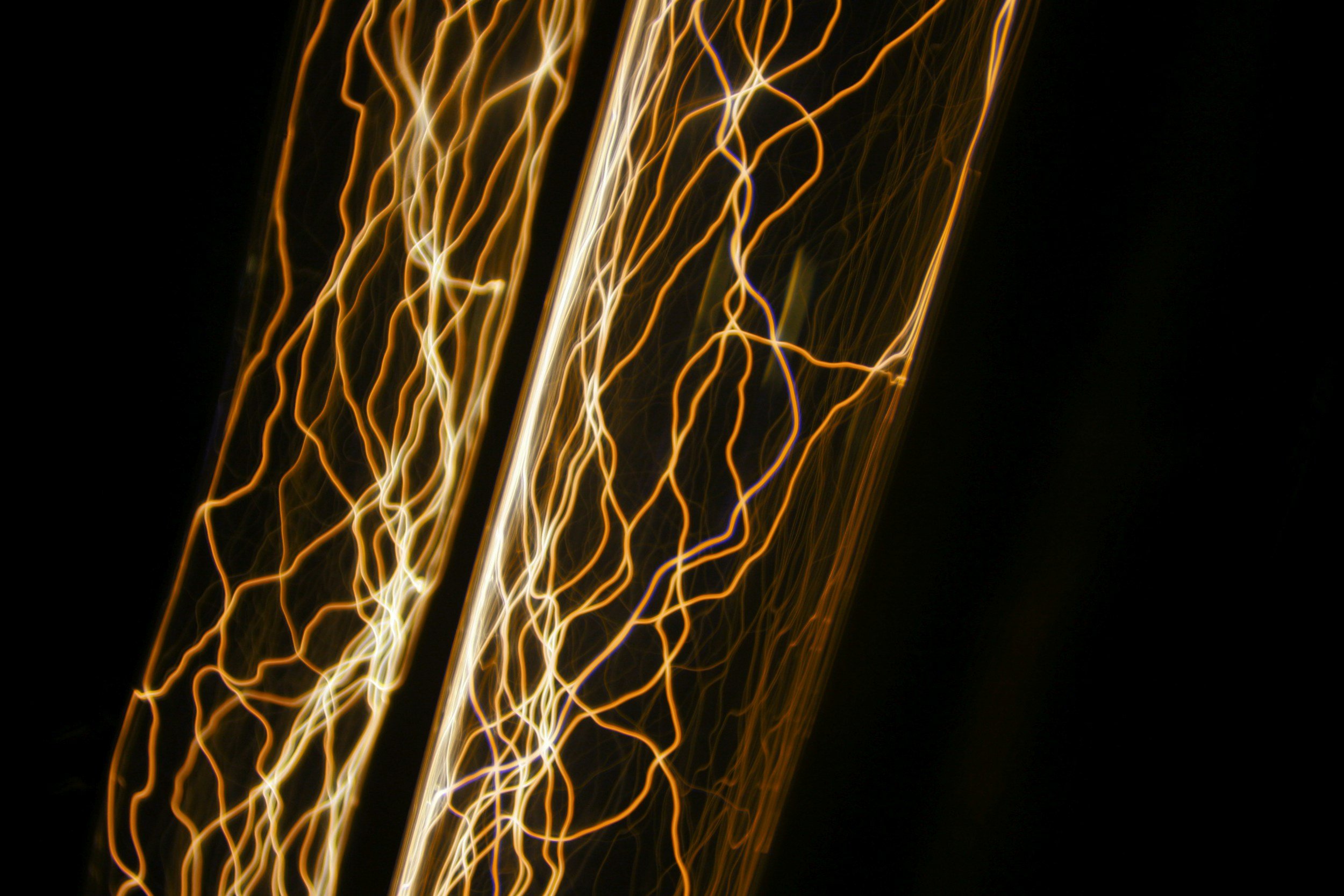 Glas tube with connecting threads glowing like gold