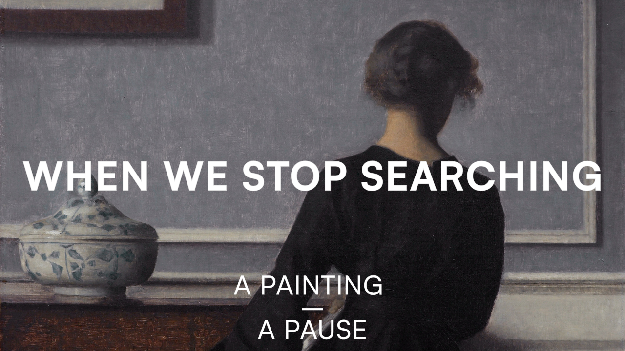 A Painting by Vilhelm Hammershøi with a women, that has her back to us and the text "When We Stop Searching" over it 