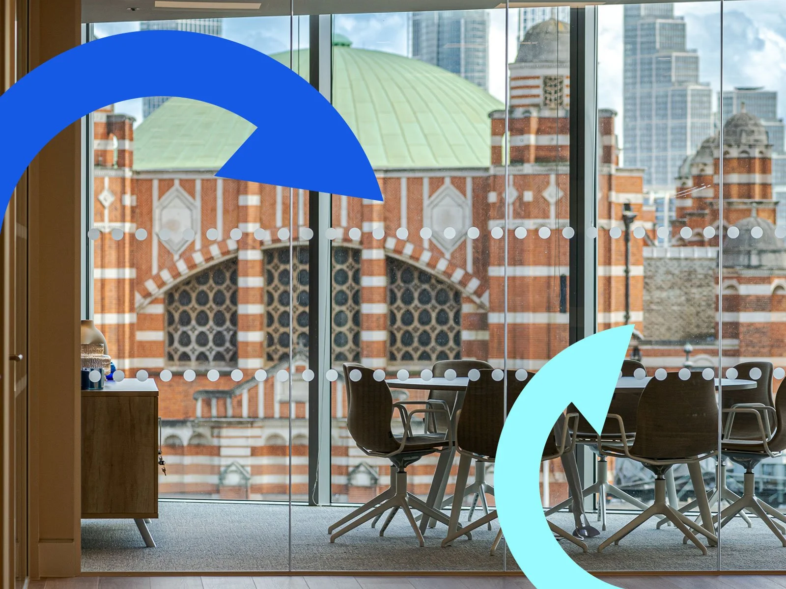 Inside a Landsec office, with a group of chairs looking out through glass windows, Circl arrows overlayed