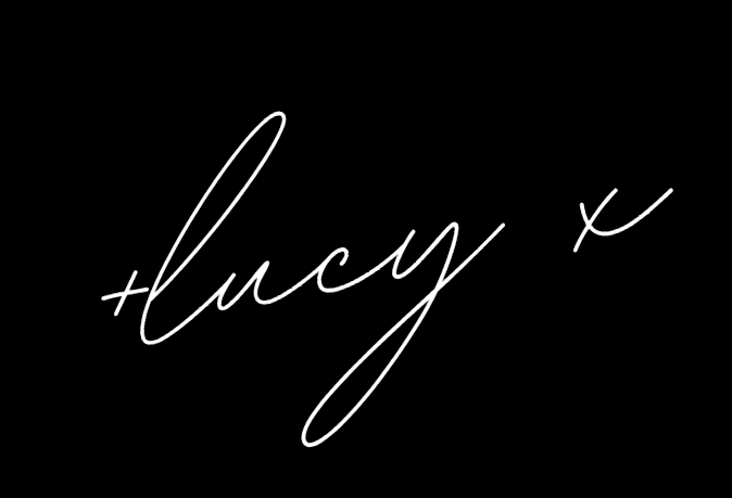 White cursive writing on a black background spelling 'lucy'.
