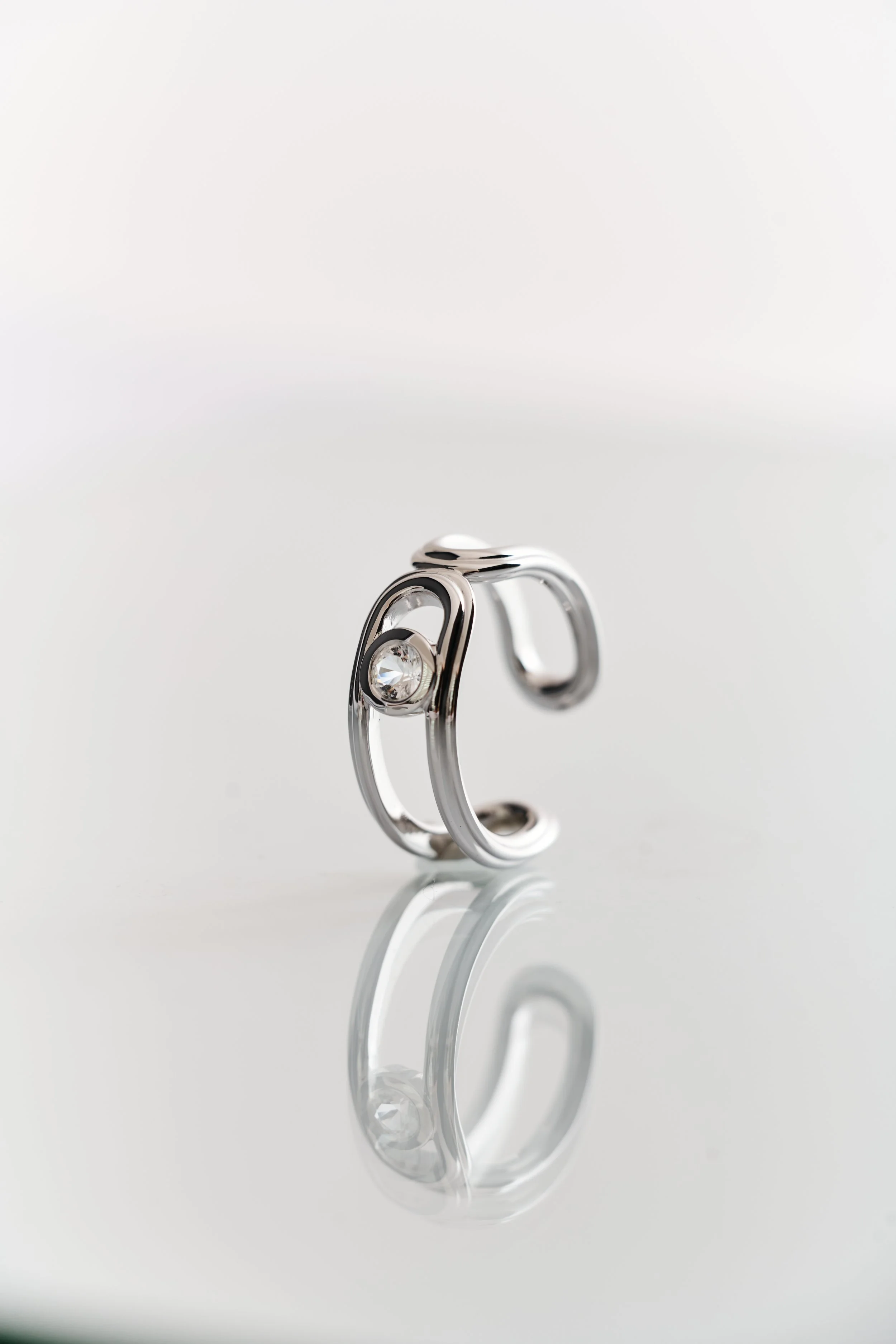 Hollow Hoop Ring in rhodium vermeil with white topaz — a contemporary take on minimal jewellery design.