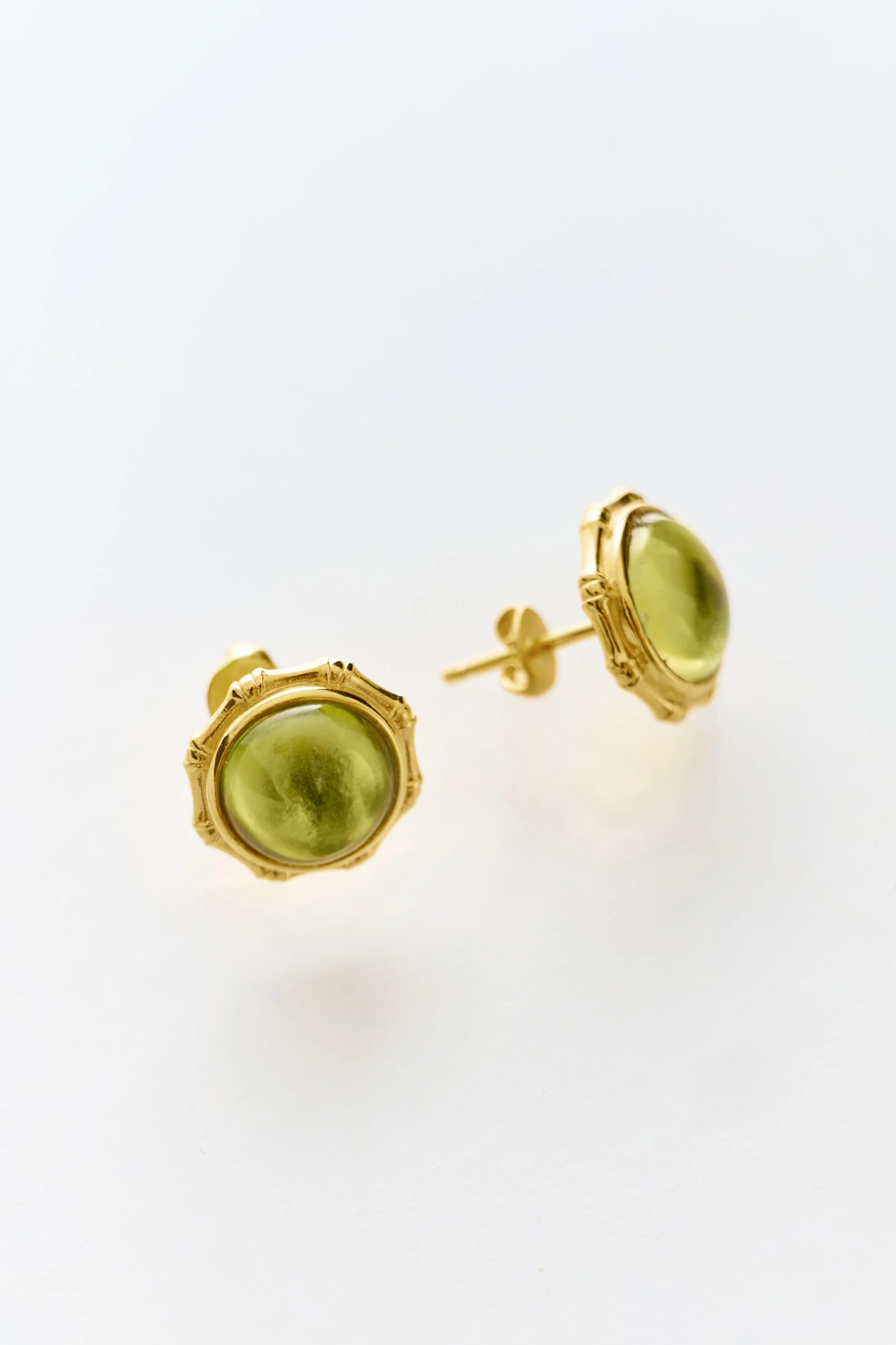 Lottie’s Loft Bamboo Earrings in 18k gold vermeil with peridot cabochon — a bold statement piece in sculptural jewellery.