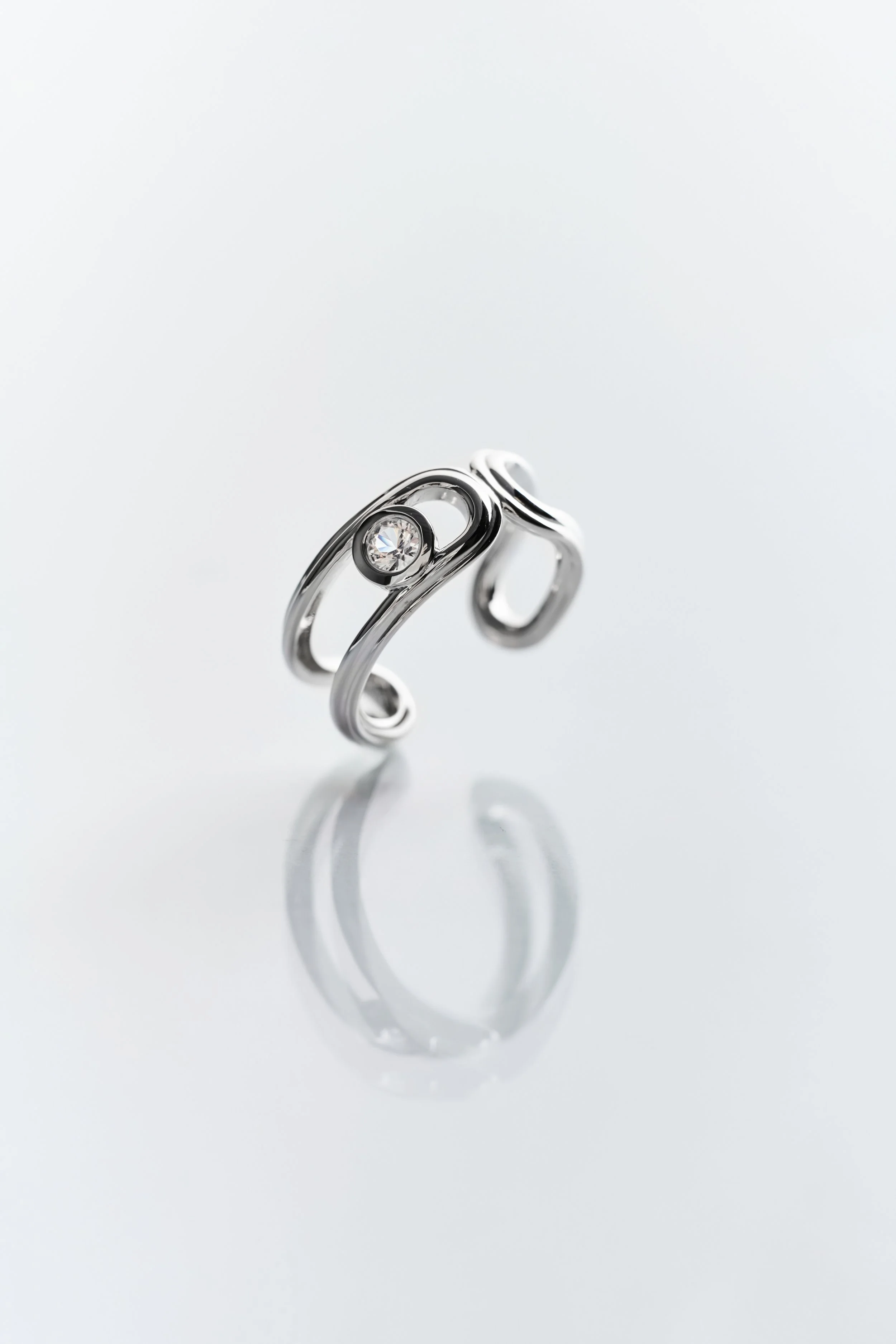 Lottie’s Loft Hollow Hoop Ring in rhodium vermeil sterling silver with white topaz — sleek, sculptural, and versatile.