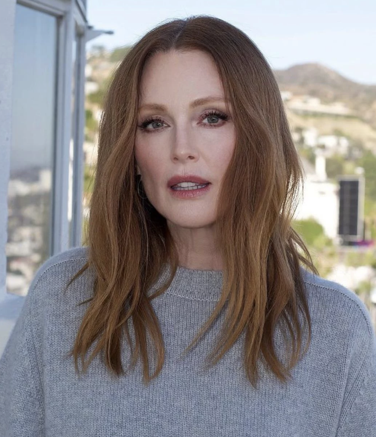 Julianne Moore on the red carpet with luminous skin, bold brow and red lip