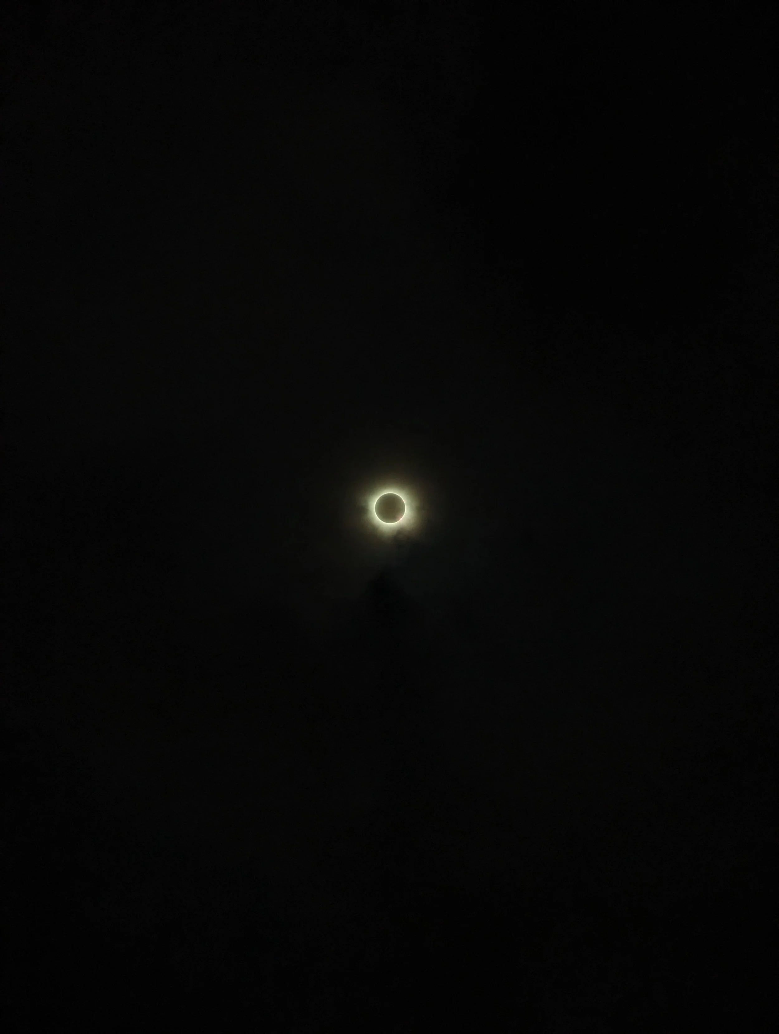 Solar eclipse with ring of light surrounded by darkness