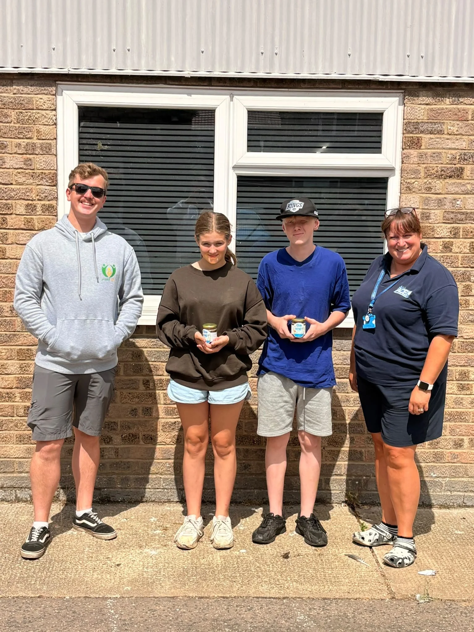 ACE CIC volunteers and their honey 