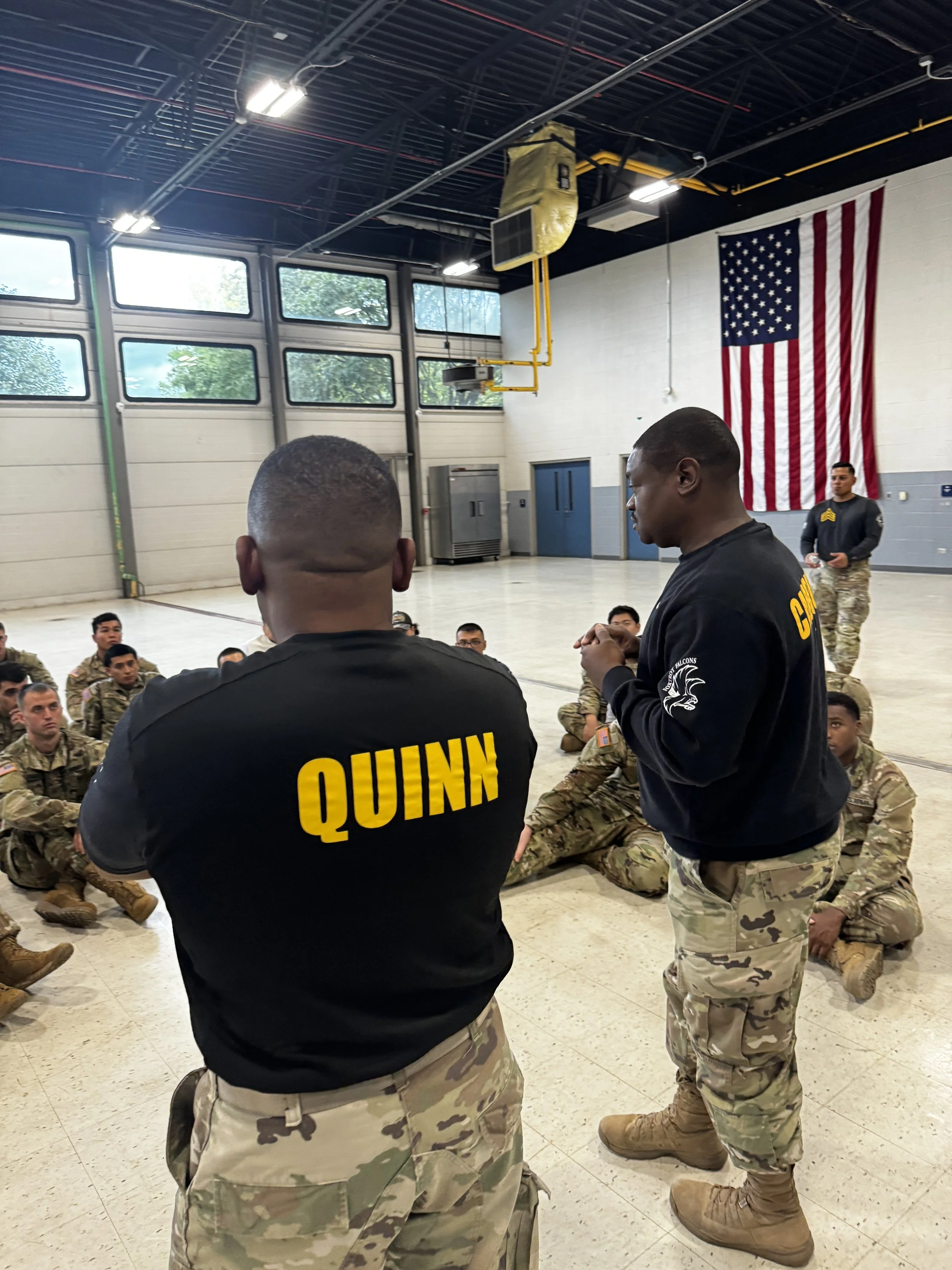 Geometric drawing of an outline square with sections divided by vertical, horizontal, and half circle lines.