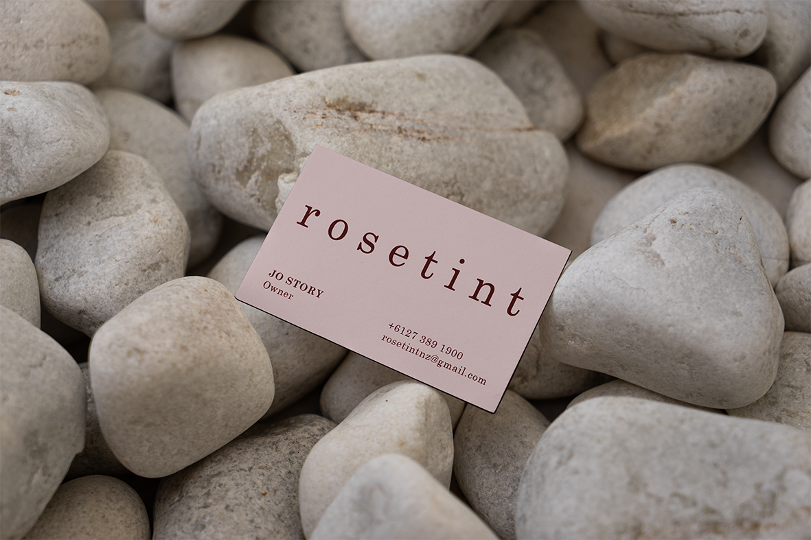 Rosetint Business Card among the Stones Mockup.png