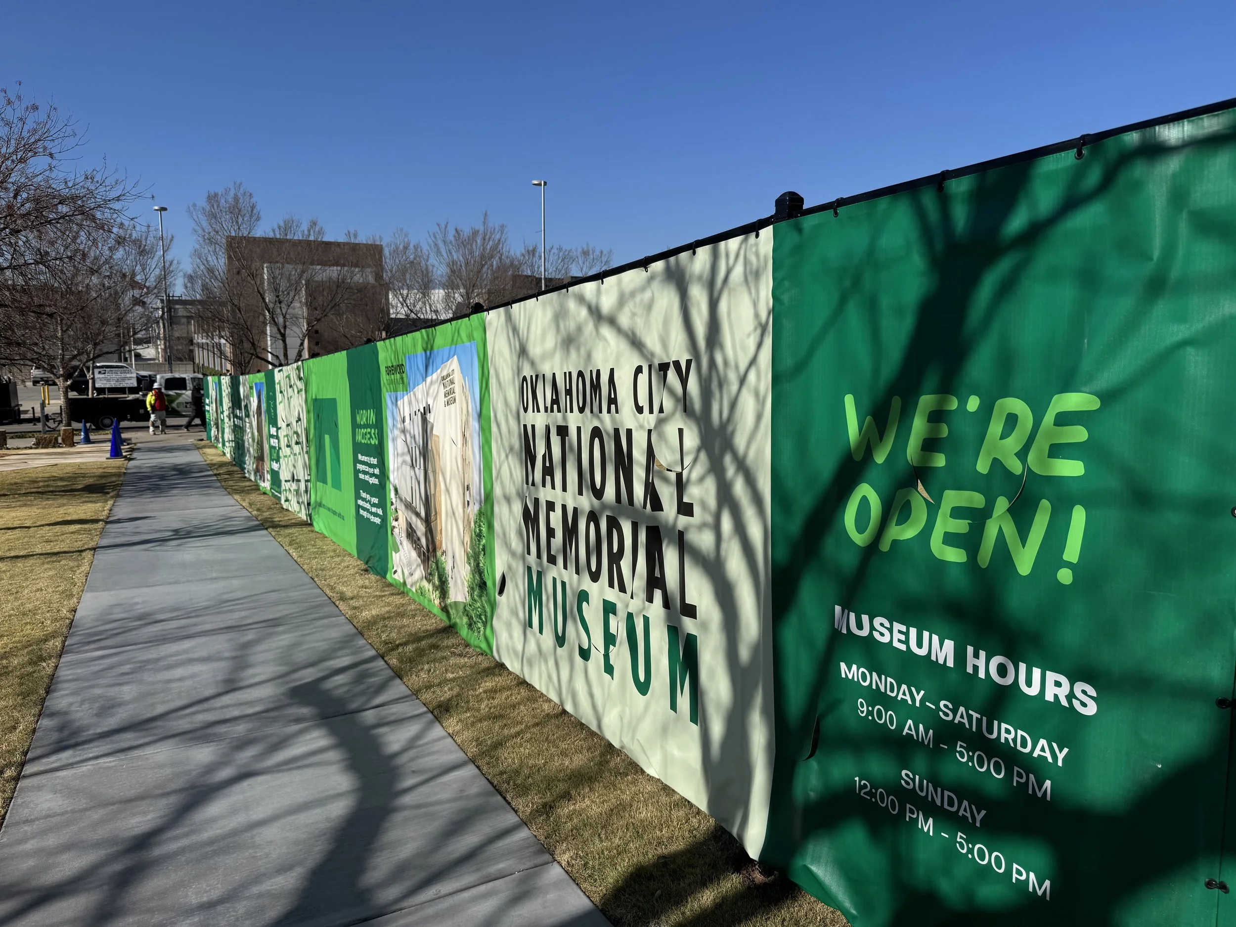 Construction fencing now frames a significant portion of the Museum’s entrance, creating an unexpected opportunity for both storytelling and wayfinding. Through thoughtful graphics and messaging, the fence clearly signals how to access the Museum whi