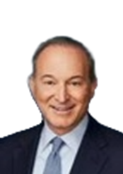 A middle-aged man with a receding hairline, wearing a dark suit, light blue shirt, and a striped tie, smiling at the camera.