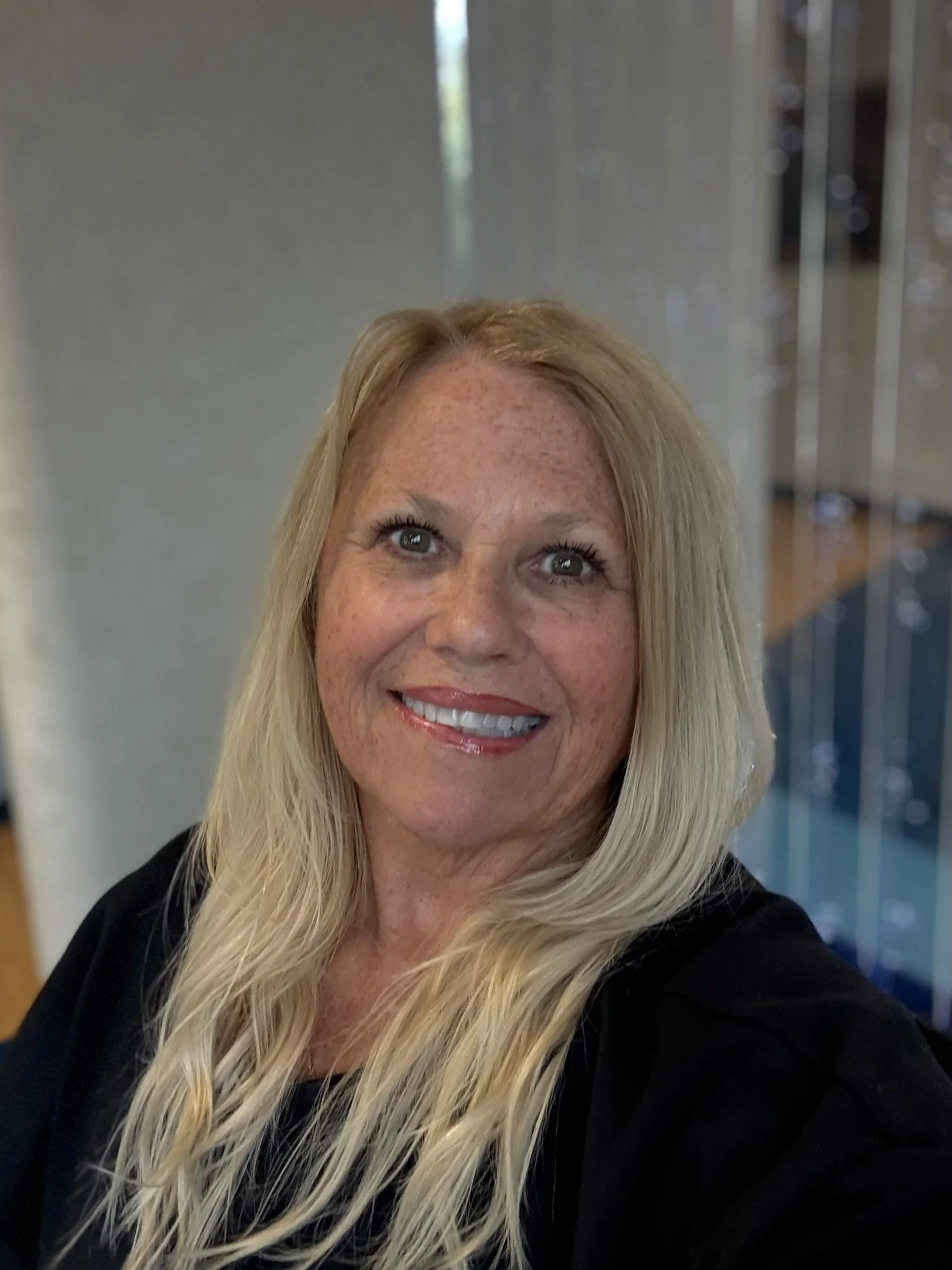 Dental hygienist smiling in the pediatric dental office